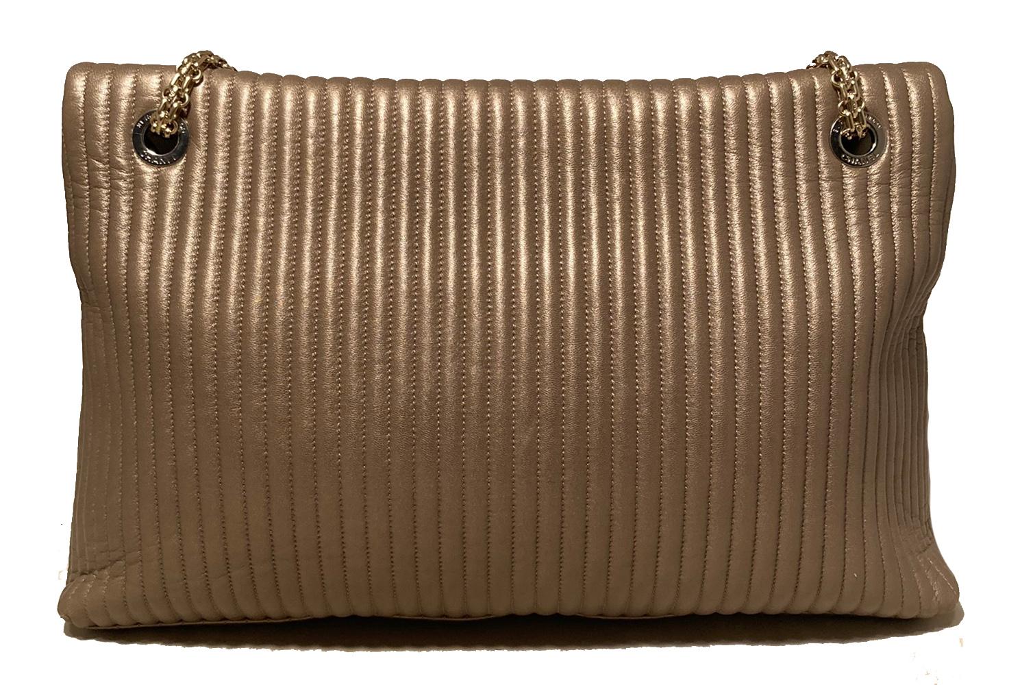 Chanel Vertical Stripe Quilted Classic Flap Reissue in excellent condition. Beautiful metallic champagne gold leather exterior in unique vertical stripe quilted pattern with matte gold reissue chain shoulder strap. Front mademoiselle twist closure