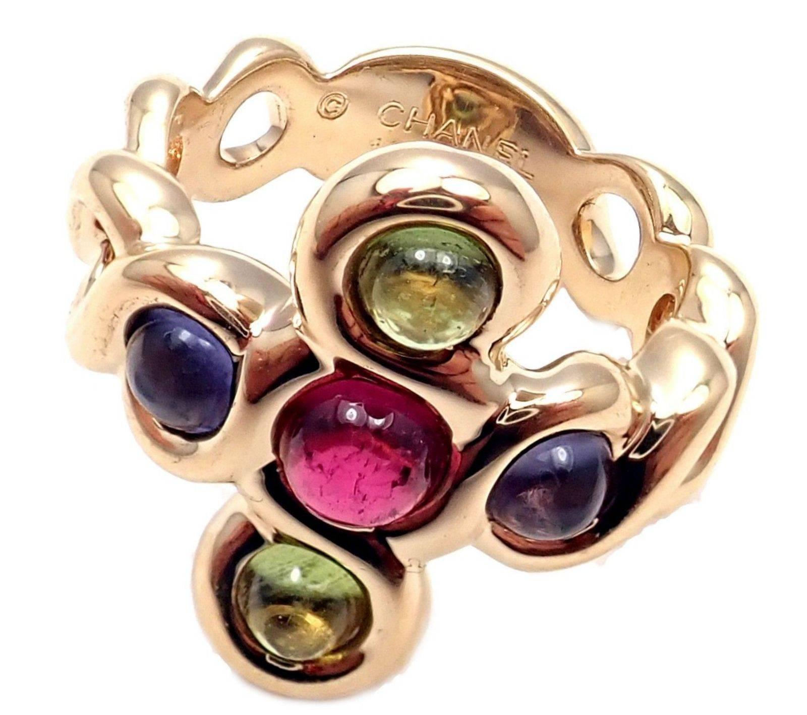 18k Yellow Gold Pink And Green Tourmaline Ring by Chanel. 
With 2 Round Amethyst stones 3.5mm
1 Round Pink Tourmaline stone 4mm
2 Round Green Tourmaline stones 3.5mm
Details: 
Ring Size: 4.5
Width at top: 19mm
Weight: 10.2 grams
Stamped Hallmarks: 