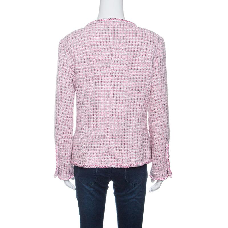 Chanel designs are known for their class and elegance, and this textured jacket, flaunting a blend of pink and white hues is crafted in a cotton and nylon blend featuring long sleeves and two external pockets. It comes with a CC embossed buttoned