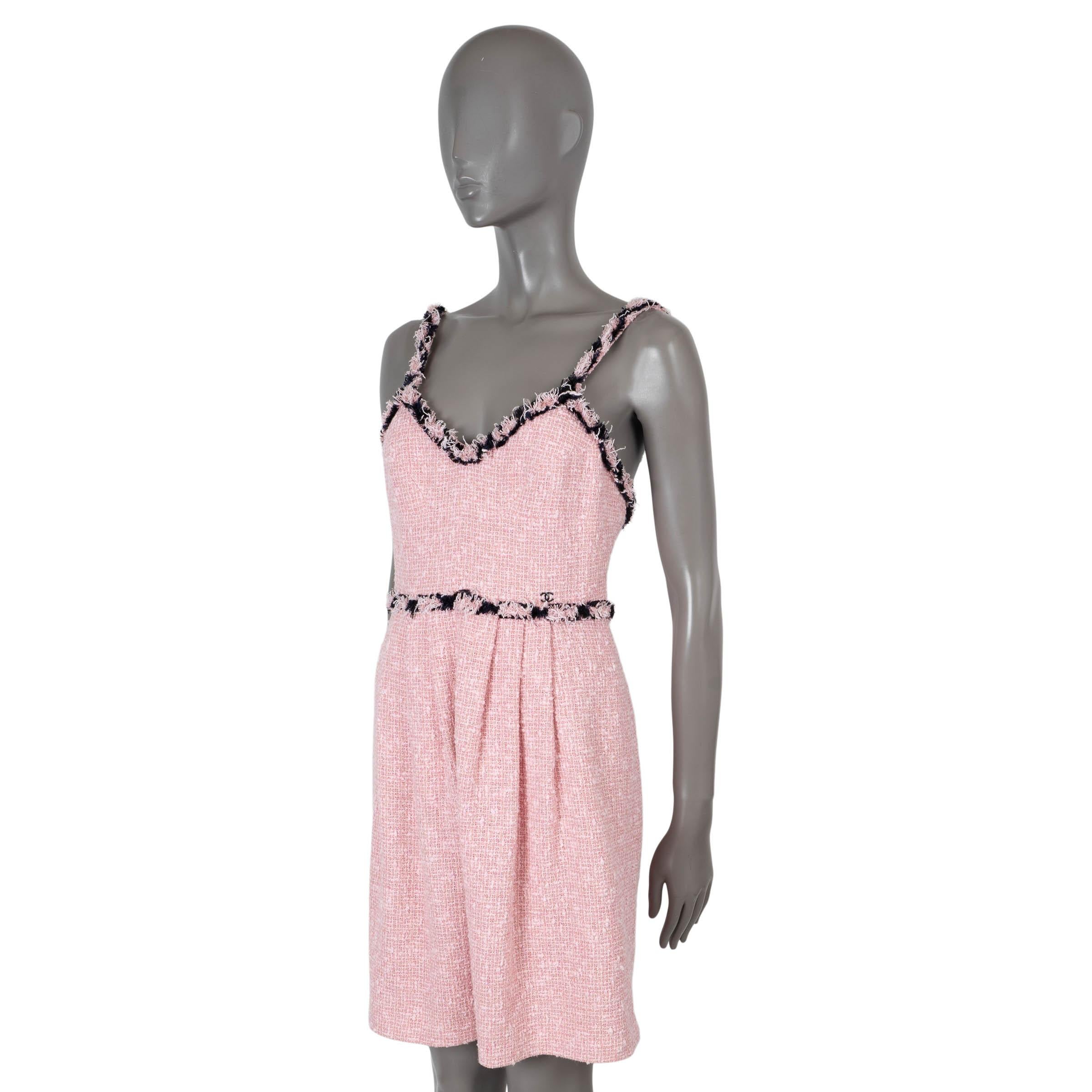 100% authentic Chanel A-Line dress in pink and black cotton (42%), acrylic (19%) and polyester (19%). Features frayed finishing on the shoulder straps, neckline and hem. Closes with pink concealed zipper and one hook. Lined in pink silk (93%) and