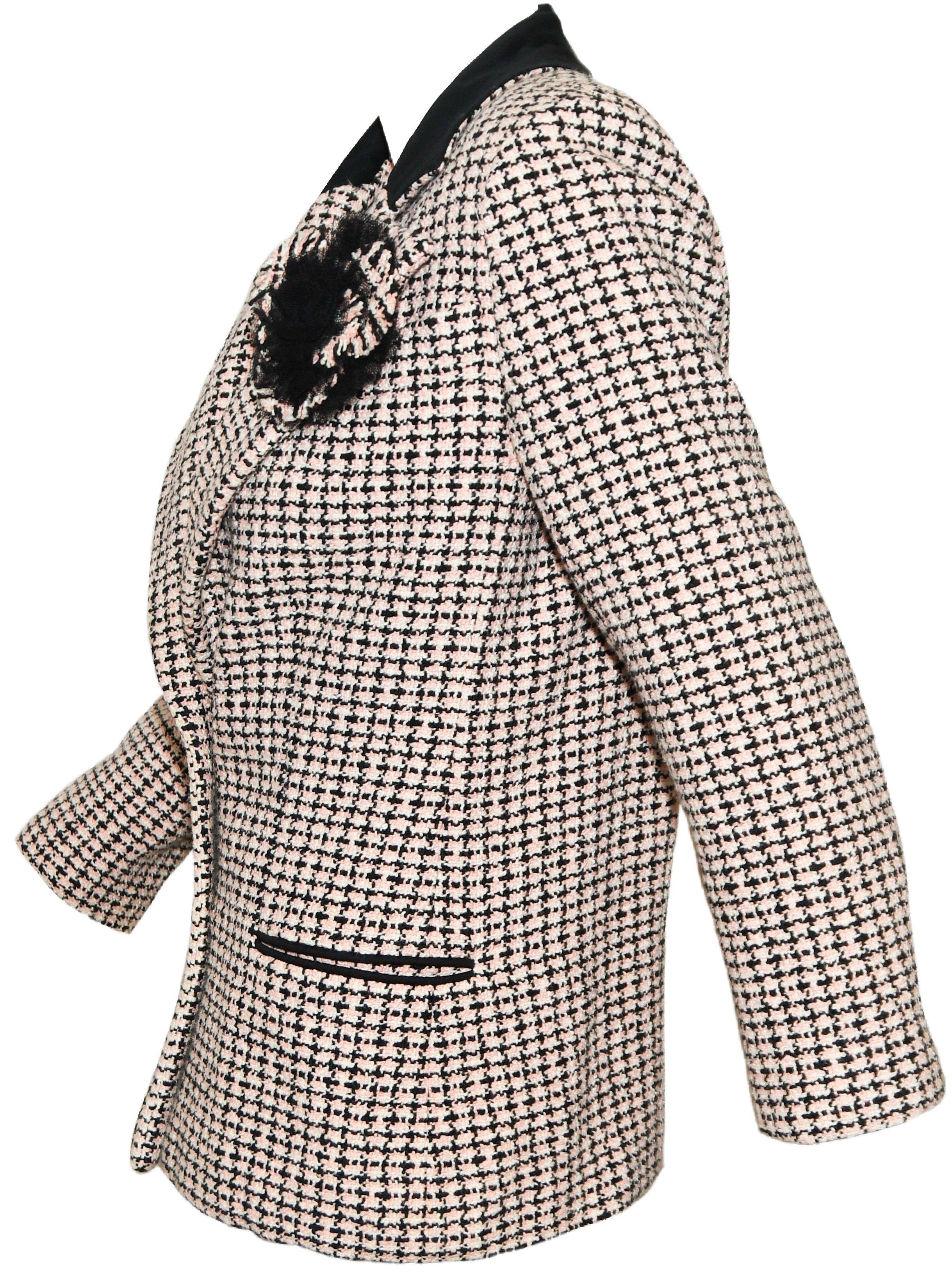 Chanel pink, black and white cotton tweed jacket is from the 2002 spring collection!  It includes a Camellia flower corsage composed of the cotton tweed fabric and black tulle, located at the lapel.   This is a 100% cotton heavier weight jacket and
