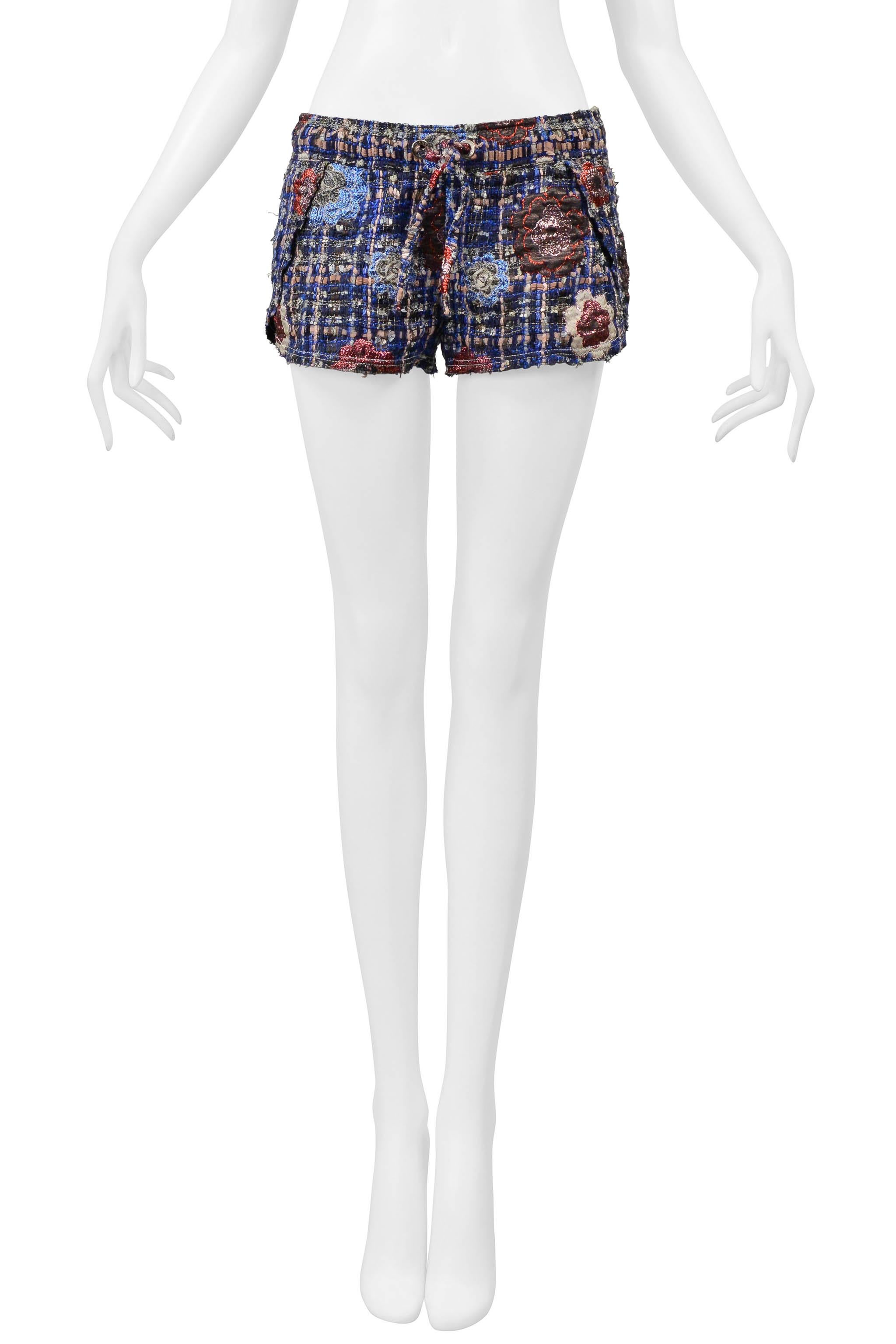 Resurrection Vintage is excited to offer vintage Chanel by Karl Lagerfeld multicolor ribbon shorts featuring two silver grommets, a fabric drawstring at the waistband, a flat back, iconic Chanel camellias, and an easy fit. 

Chanel, Paris
By Karl