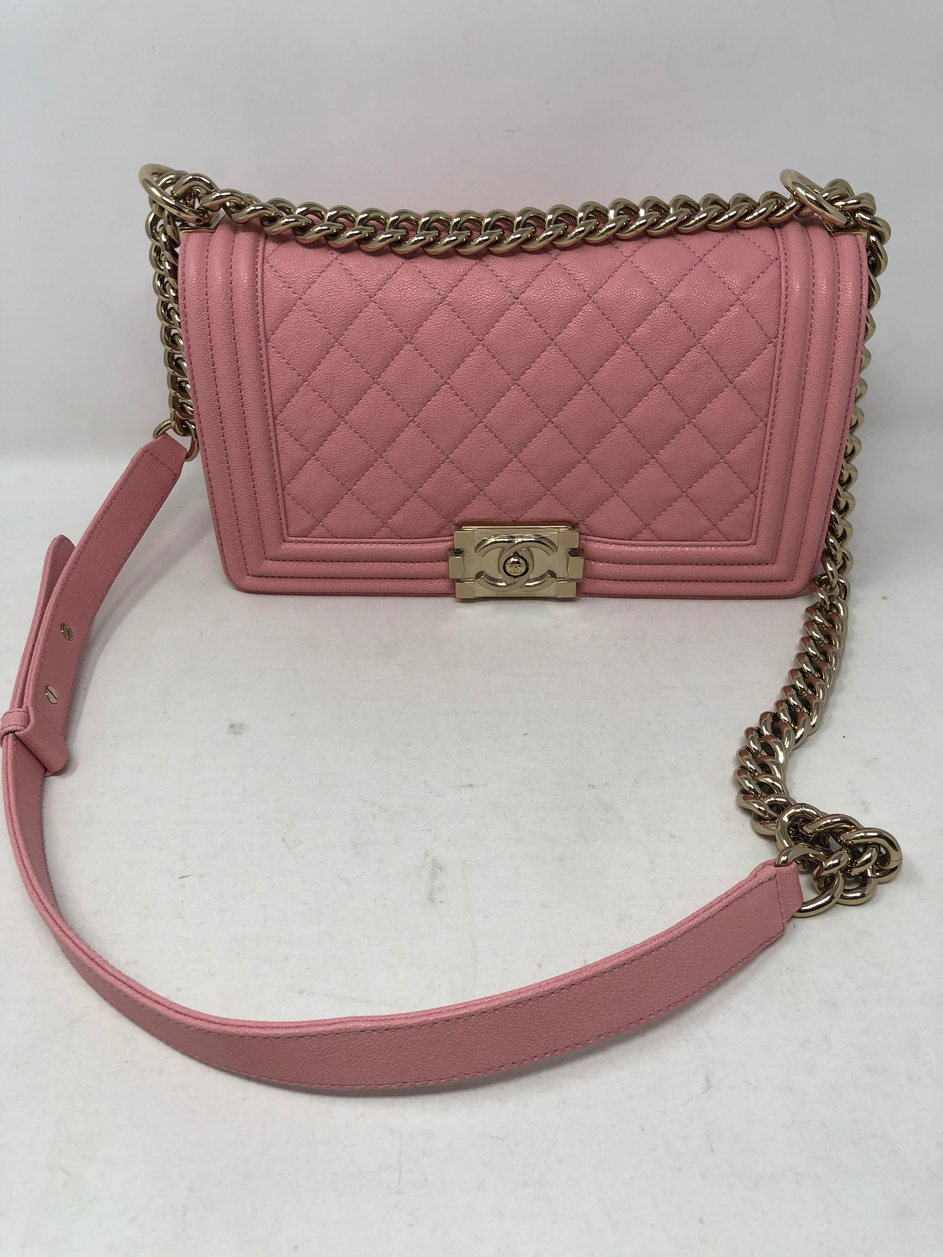 Chanel Pink Medium Boy Bag with gold hardware. Pale pink leather in brand new condition. Never used. Still has plastic on hardware. Includes complete set with dust cover, box and authenticity card. Beautiful bag would make a great gift. Guaranteed