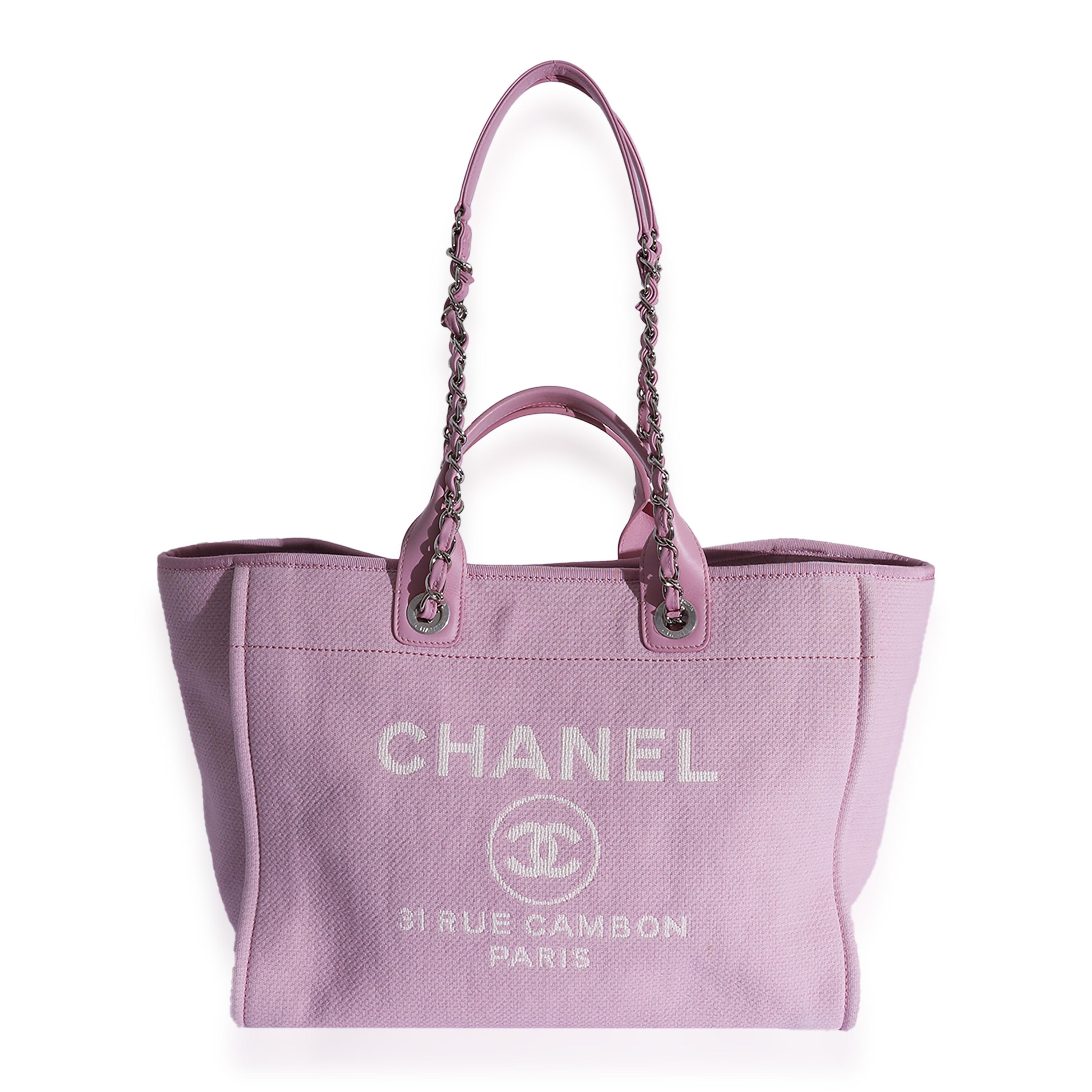 Listing Title: Chanel Pink Canvas Large Deauville Tote
SKU: 125220
Condition: Pre-owned 
Handbag Condition: Very Good
Condition Comments: Very Good Condition. Plastic at some hardware. Light peeling at handles. Light exterior scuffing at corners and