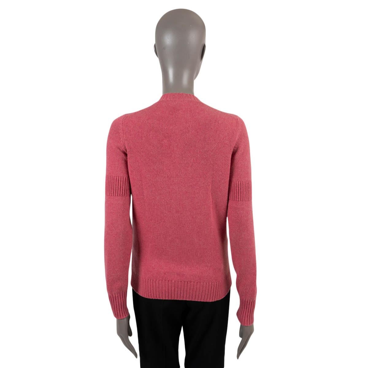 100% authentic Chanel 2009 round-neck cardigan in pink cashmere (100%). The design features gold-tone metal CC turn-lock buttons, ribbed waistband, cuff and upper arm. Has been worn and is in excellent condition. 

Measurements
Model	09A P36538