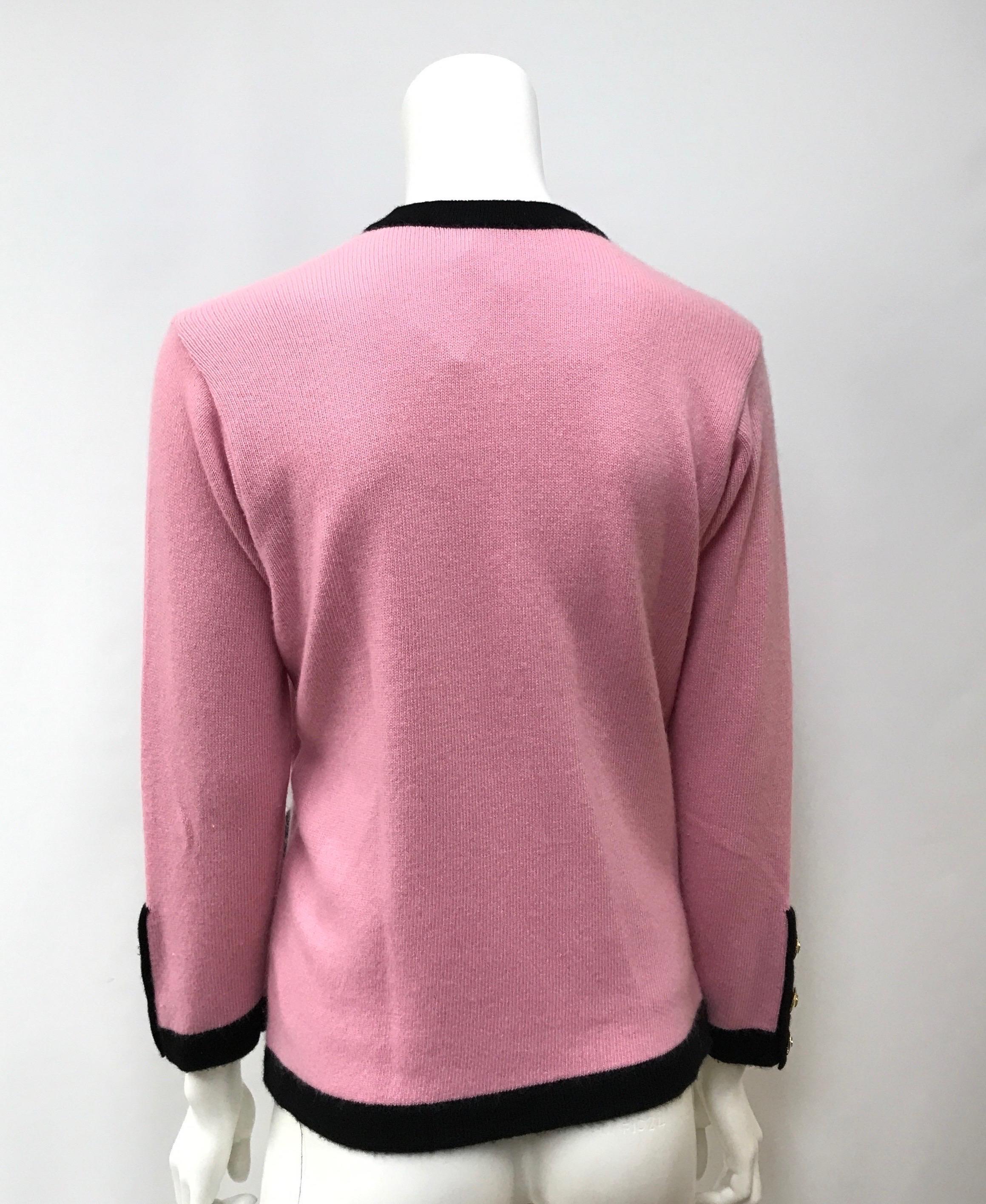 pink cardigan with black trim