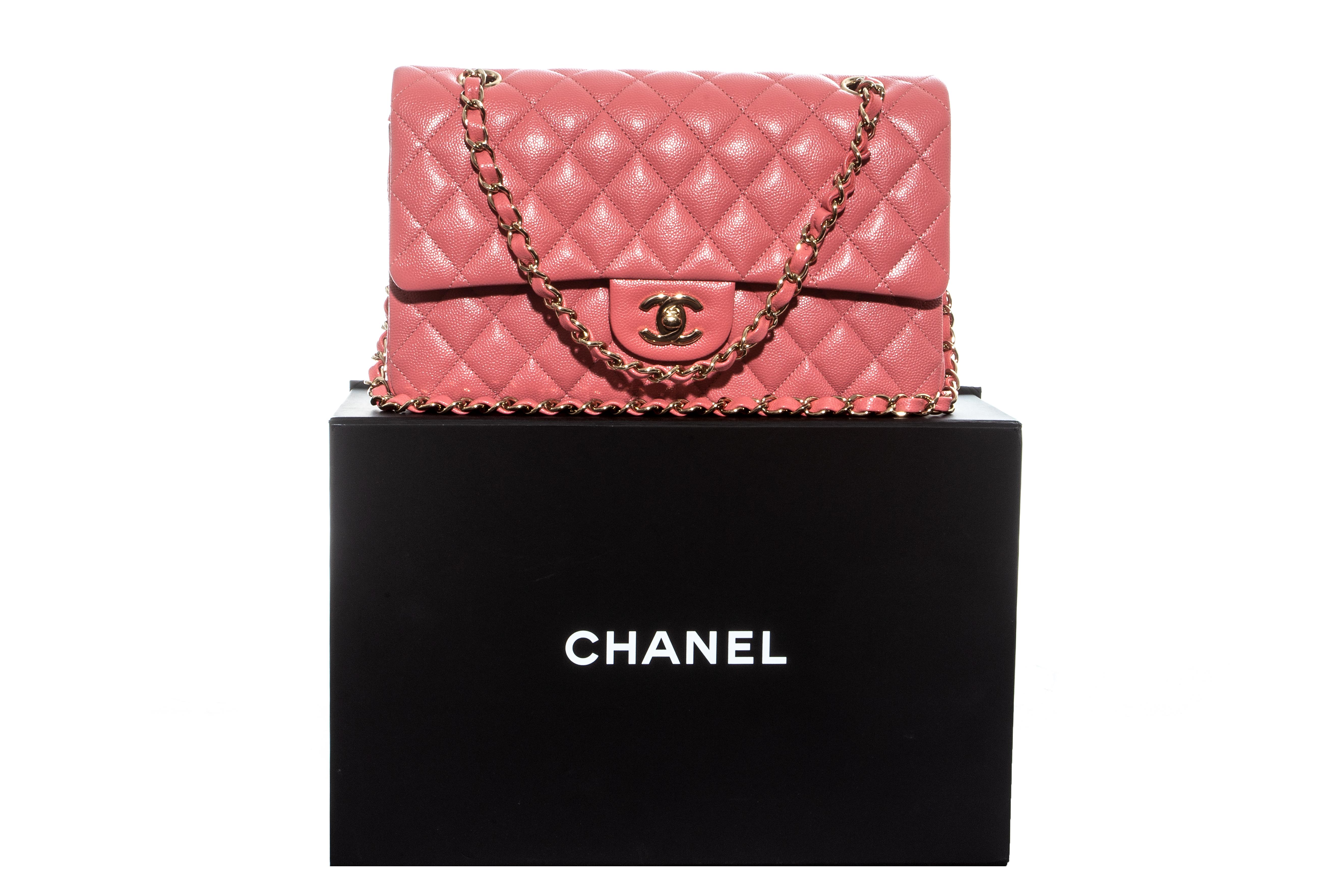 Chanel pink caviar leather classic 2.55 flap bag with gold hardware and adjustable chain. Signature Chanel diamond quilts, 'CC' turn clasp and fabric interior. Sold with original packaging.

Excellent condition