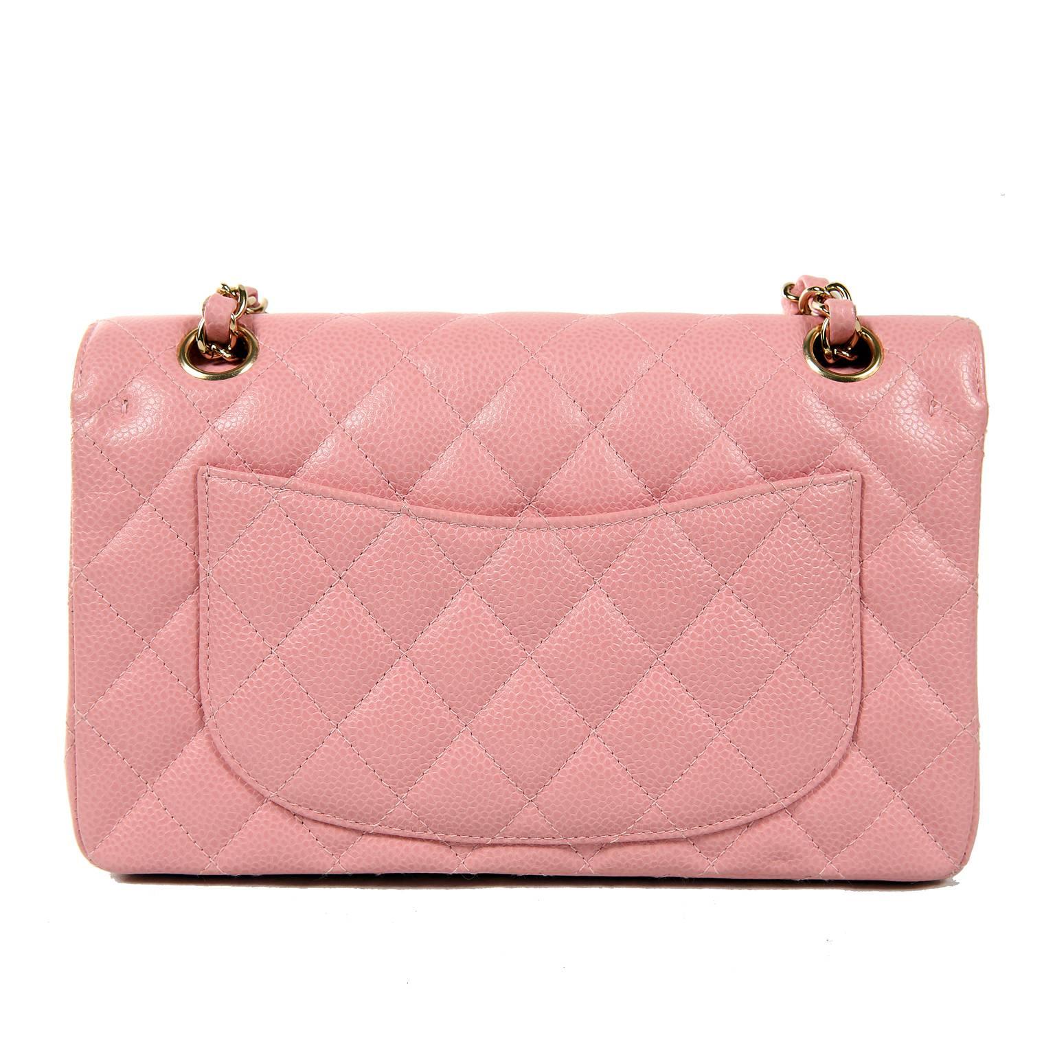 Pink Caviar Medium Classic Flap Bag-  PRISTINE
Never carried and carefully stored, this stunning Chanel elevates every ensemble. 
Durable and textured pink caviar leather is quilted in signature Chanel diamond pattern.  Gold interlocking CC twist