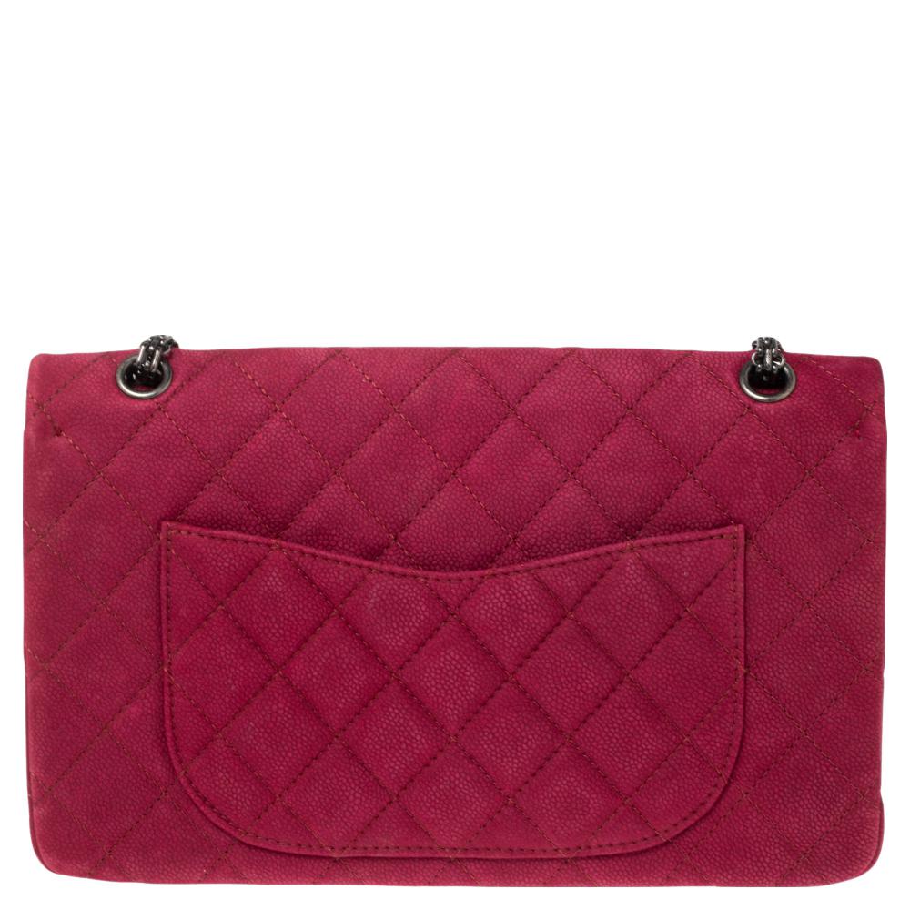 Chanel's Flap Bags are iconic and noteworthy in the history of fashion. Hence, this Reissue 2.55 is a buy that is worth every bit of your splurge. Exquisitely crafted from pink Caviar suede, it bears their signature quilt pattern and the iconic