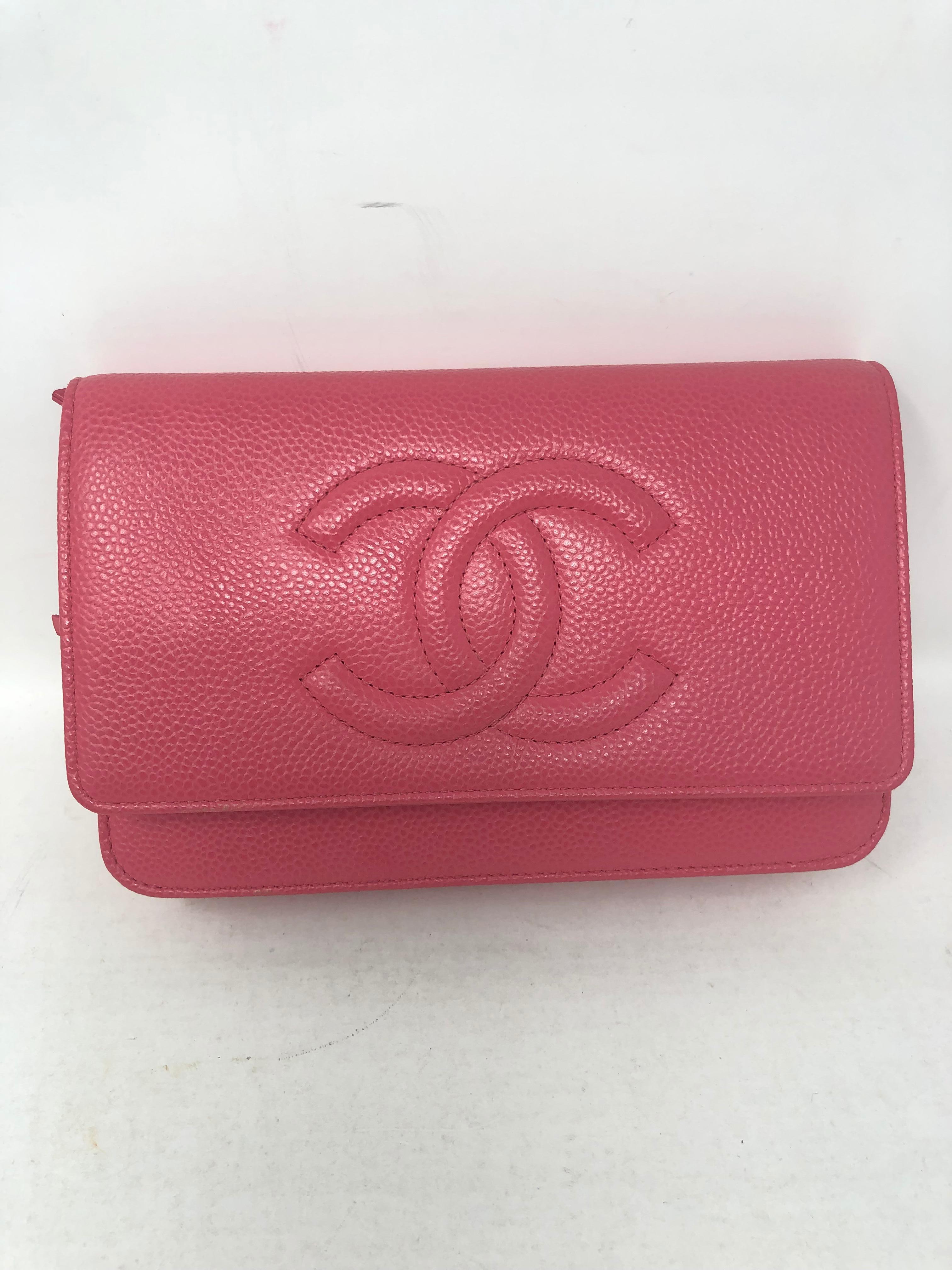 Chanel Pink Caviar Leather Wallet On A Chain. Silver hardware. Excellent condition. Hard to find WOC. Can be worn as a clutch or as a crossbody bag. Includes authenticity card and original booklet care. Guaranteed authentic. 