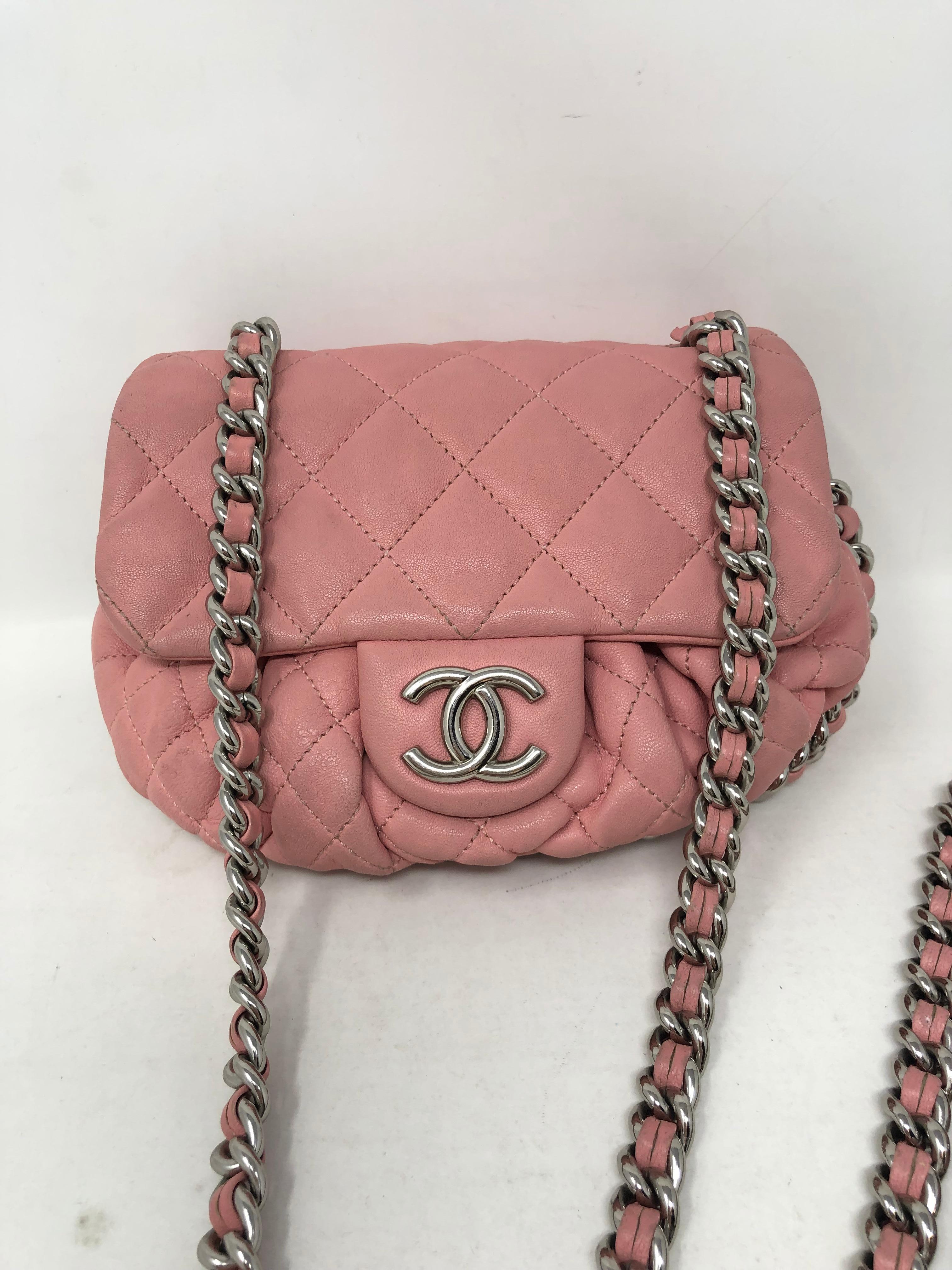 Chanel Pink Chain Around Bag. Blush pink leather with silver hardware. Chain around the bottom and can be worn crossbody. Good condition. Includes authenticity card. Guaranteed authentic. 