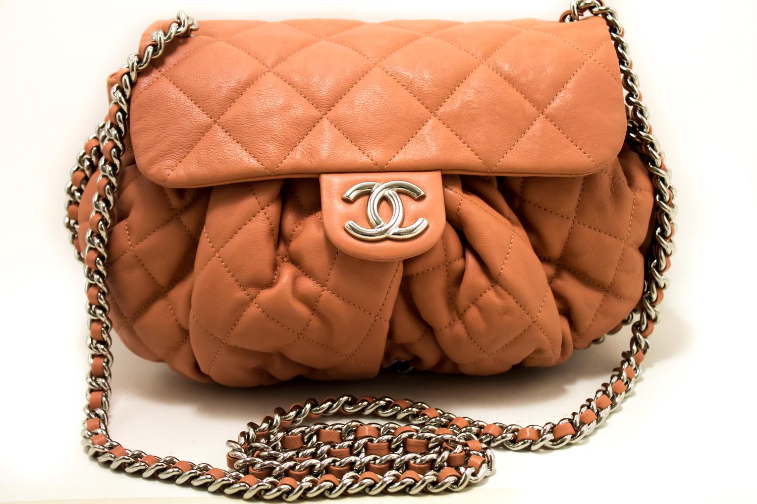 An authentic CHANEL Pink Chain Around Shoulder Bag Crossbody Quilted Flap. The color is Pink. The outside material is Leather. The pattern is Solid.
Conditions & Ratings
Outside material: Calfskin
Color: Pink
Closure: Magnetic snap
Hardware and
