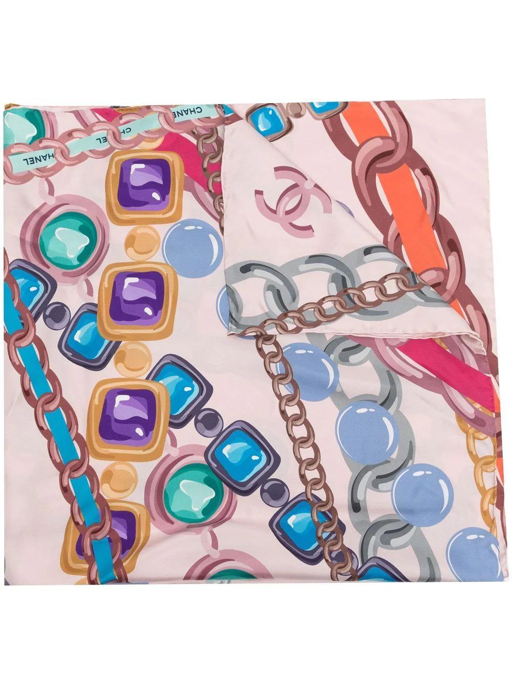 Crafted from pink silk, this pre-owned scarf displays a number of Chains inspired by classic Chanel necklaces such as the Maison's famous Gripoix jewellery and chain belts. Finished with the brand's iconic Chanel logo. Tie it around your neck or the