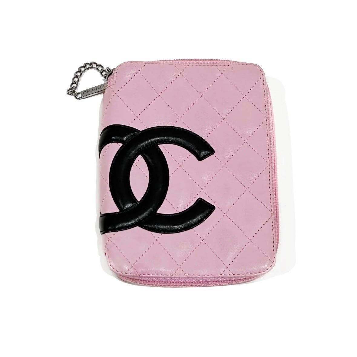 Pink Cosmetic CC Quilted Bag by Chanel
Circa 2004 Ligne Cambon Campaign 
Made in Italy
Pink leather
Quilted detail on leather
Large black CC logo detail
Zip closure with link chain zipper
Silver tone hardware
Back has open pocket
Interior has dual