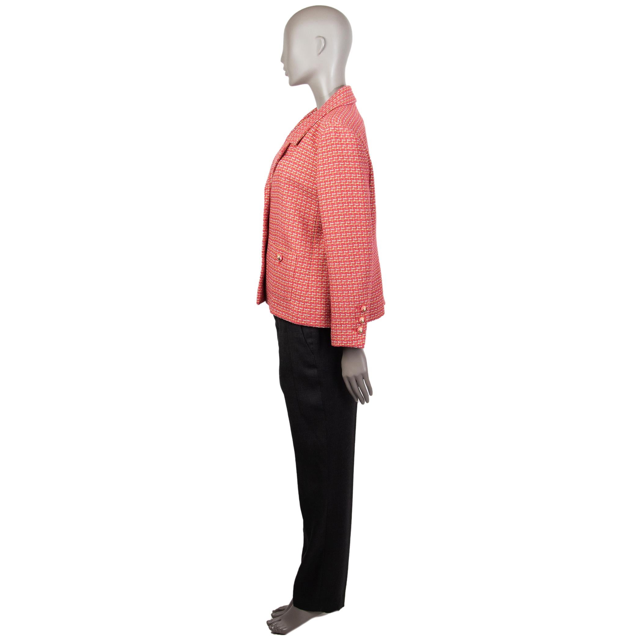 Chanel tweed blazer in watermelon, lime, silver, and off-white cotton (73%), polyester (16%), and nylon (12%). With notch collar, buttoned patch pockets on the front, buttoned sleeves, and signature chain around the inside of the hemline. Closes