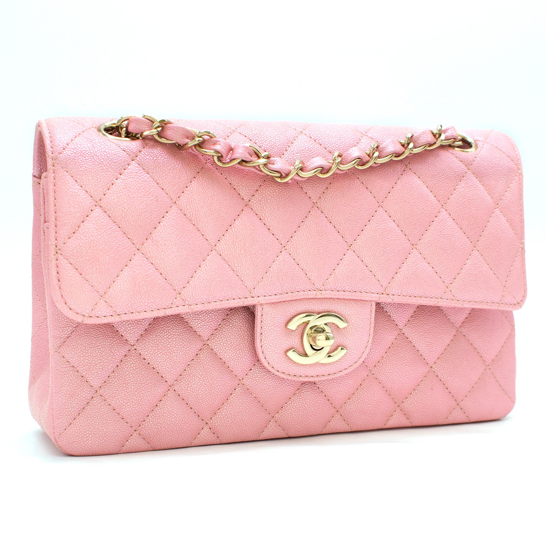 Chanel Pink Iridescent Caviar Classic Flap Bag

-Iridescent pink, 100% caviar leather 
-Gold-toned hardware
-Twist-lock closure and push button closure with classic Chanel logo 
-Cross-stitching design
-Double chain straps
-Two interior pockets
-Two
