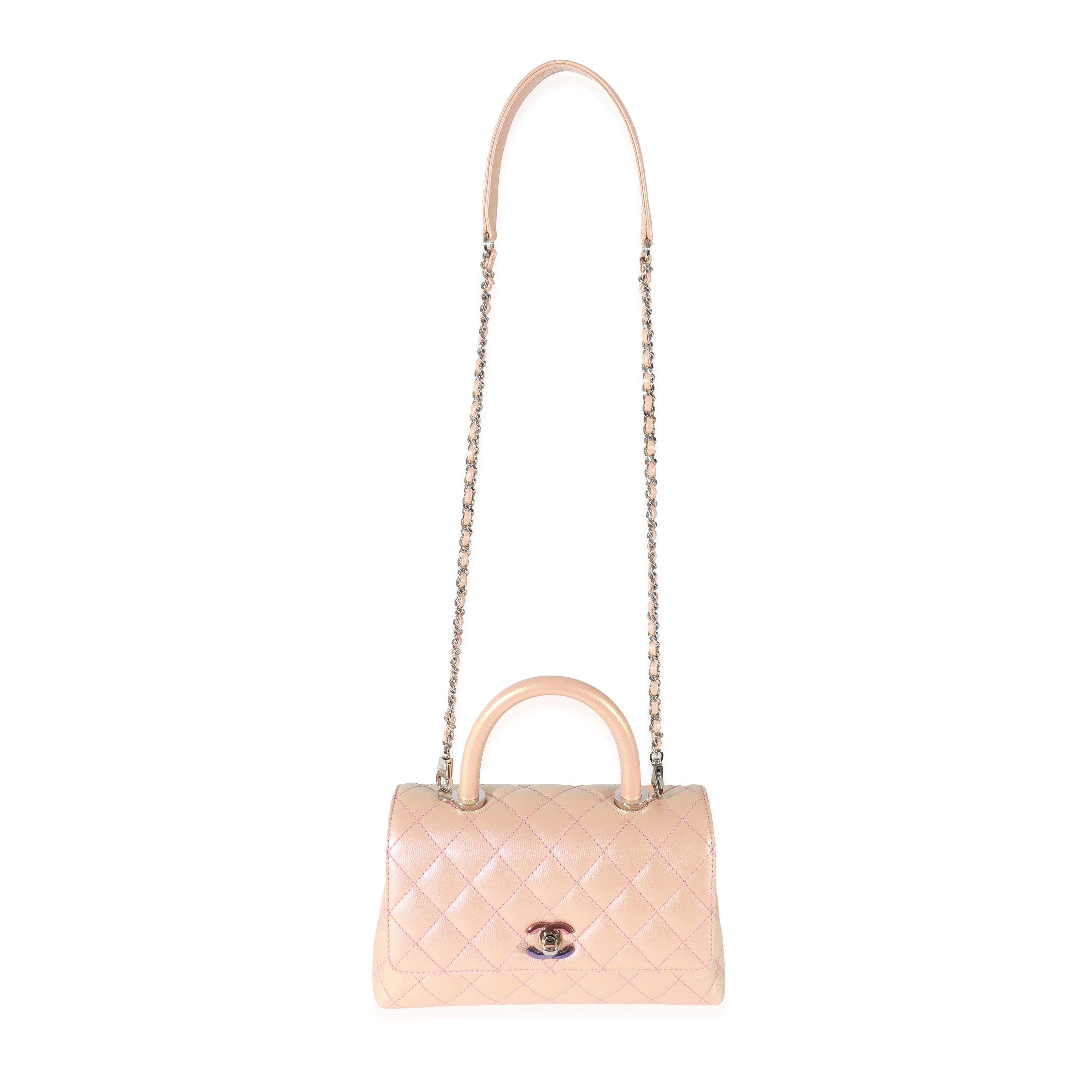 Listing Title: Chanel Pink Iridescent Quilted Caviar Coco Top Handle
 SKU: 128514
 Condition: Pre-owned 
 Handbag Condition: Very Good
 Condition Comments: Very Good Condition. Exterior corner scuffing. Faint scratching at hardware. Interior