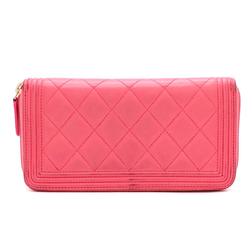 Chanel Pink Lambskin Boy Long Zipped Wallet 

-Made of the finest lambskin 
-Signature quilted texture 
-Iconic boy CC logo to the front 
-Boy line quilting details 
-Zip fastening to the top
-The interior is divided into 3 sections and features 3