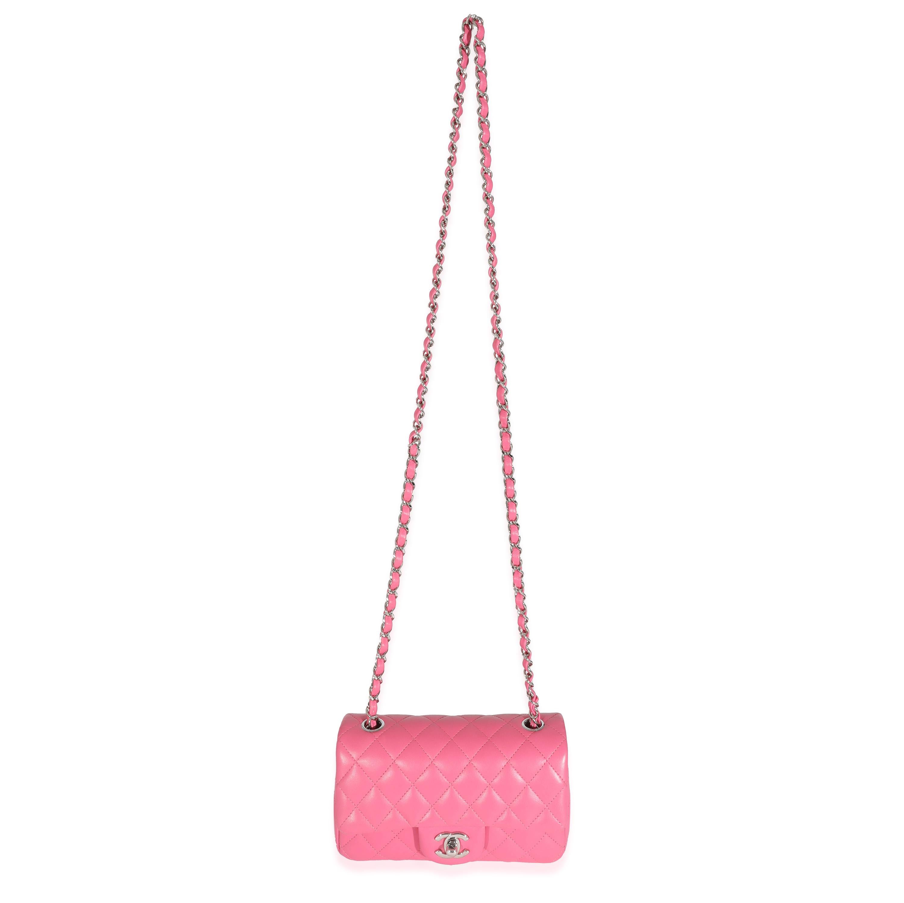 Listing Title: Chanel Pink Lambskin Classic Mini Rectangular Flap Bag
SKU: 131659
Condition: Pre-owned 
Condition Description: A timeless classic that never goes out of style, the flap bag from Chanel dates back to 1955 and has seen a number of