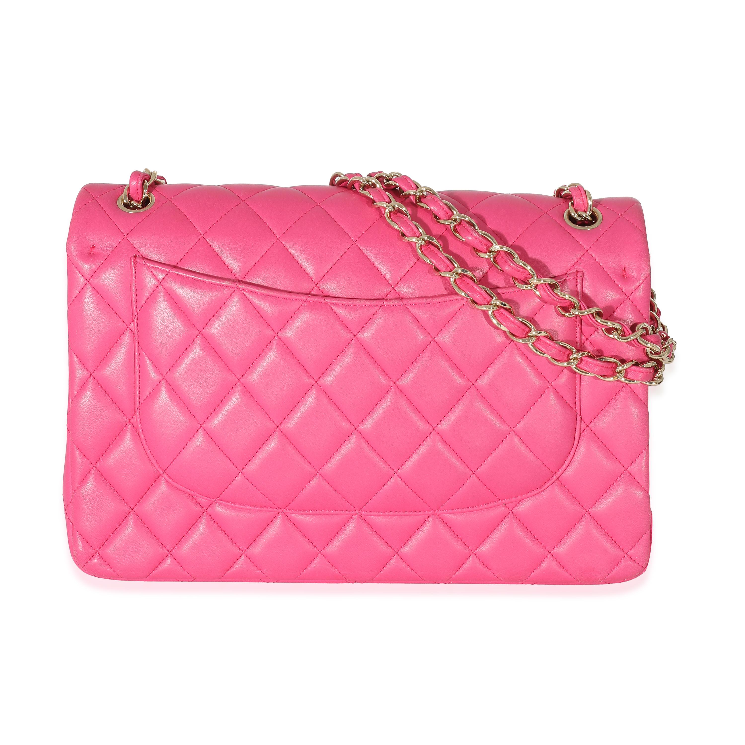 Listing Title: Chanel Pink Lambskin Jumbo Classic Double Flap Bag
SKU: 132920
Condition: Pre-owned 
Handbag Condition: Good
Condition Comments: Item is in good condition with apparent signs of wear. Serial number detached. Scuffing to corners and