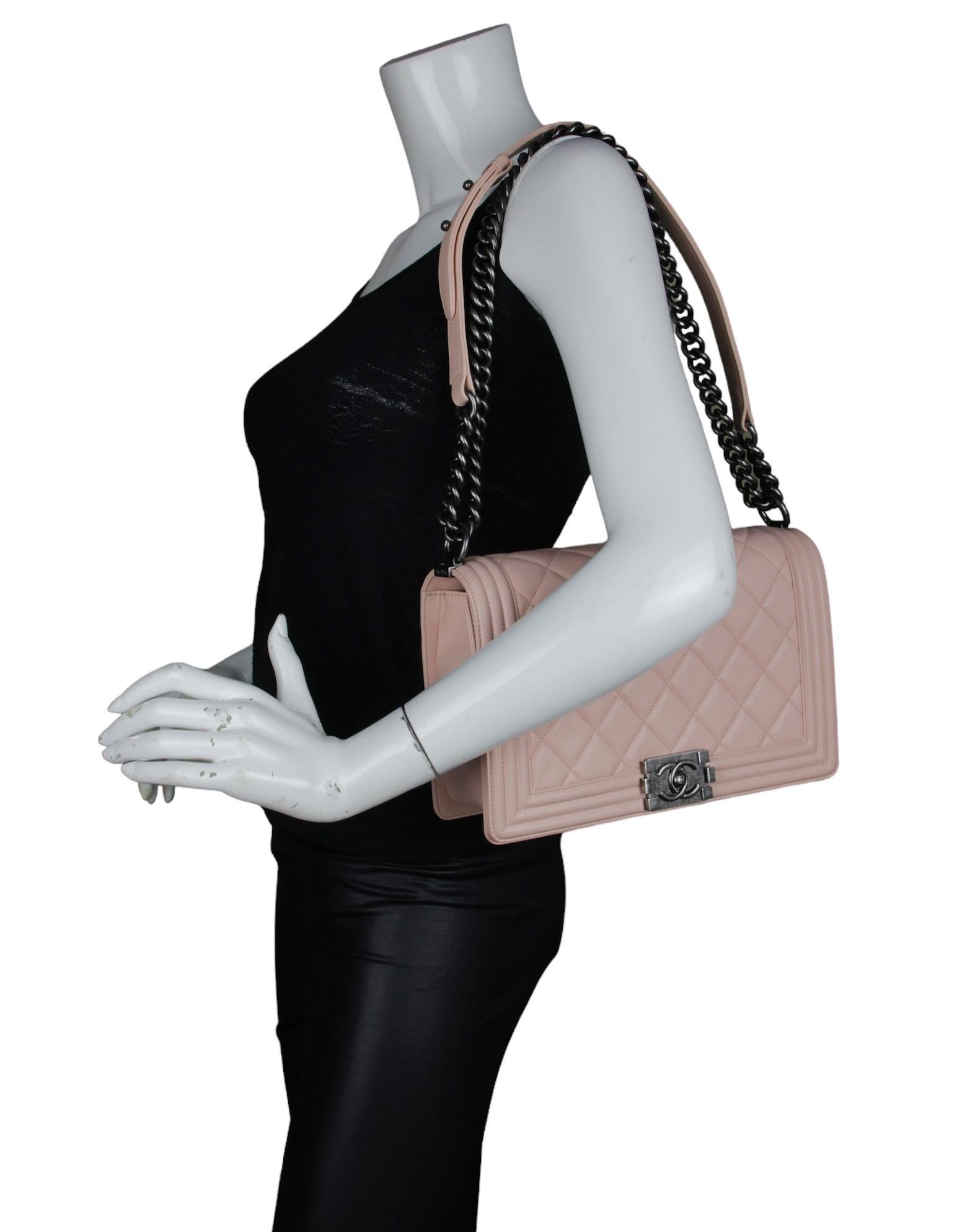 Chanel Pink Lambskin Leather New Medium Boy Bag    

Made In: Italy
Year of Production: 2014
Color: Pink
Hardware: Ruthenium (darkened silvertone)
Materials: Leather
Lining: Grosgrain
Closure/Opening: Flap top with pushlock
Exterior Pockets: