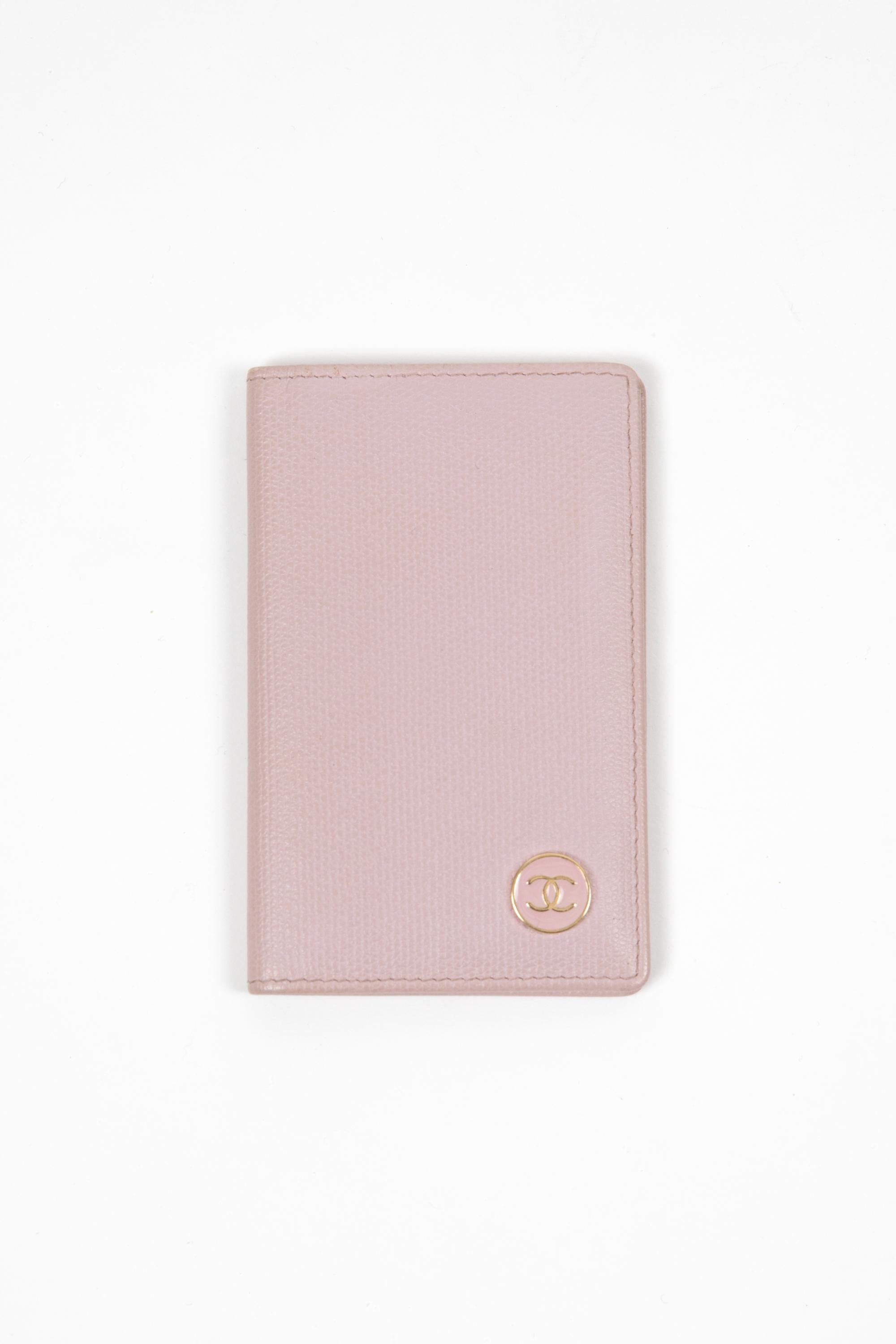Chanel Pink textured leather card holder featuring a front logo detail, inside two card slits, inside hologram and a golden hot-stamped Chanel signature. 
Delivered in original box.
Circa: 2005
In good vintage condition. Made in France.
4.3in.