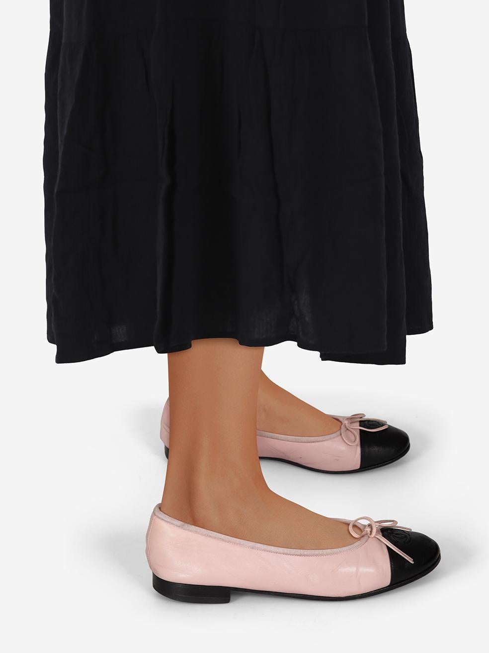 CONDITION is Verygood. Minimal wear to the flats is evident. Abrasion, discolouration and general creasing to the leather across all areas of both shoes on this used Chanel designer resale item. This pair of shoes comes in the original dust bags and