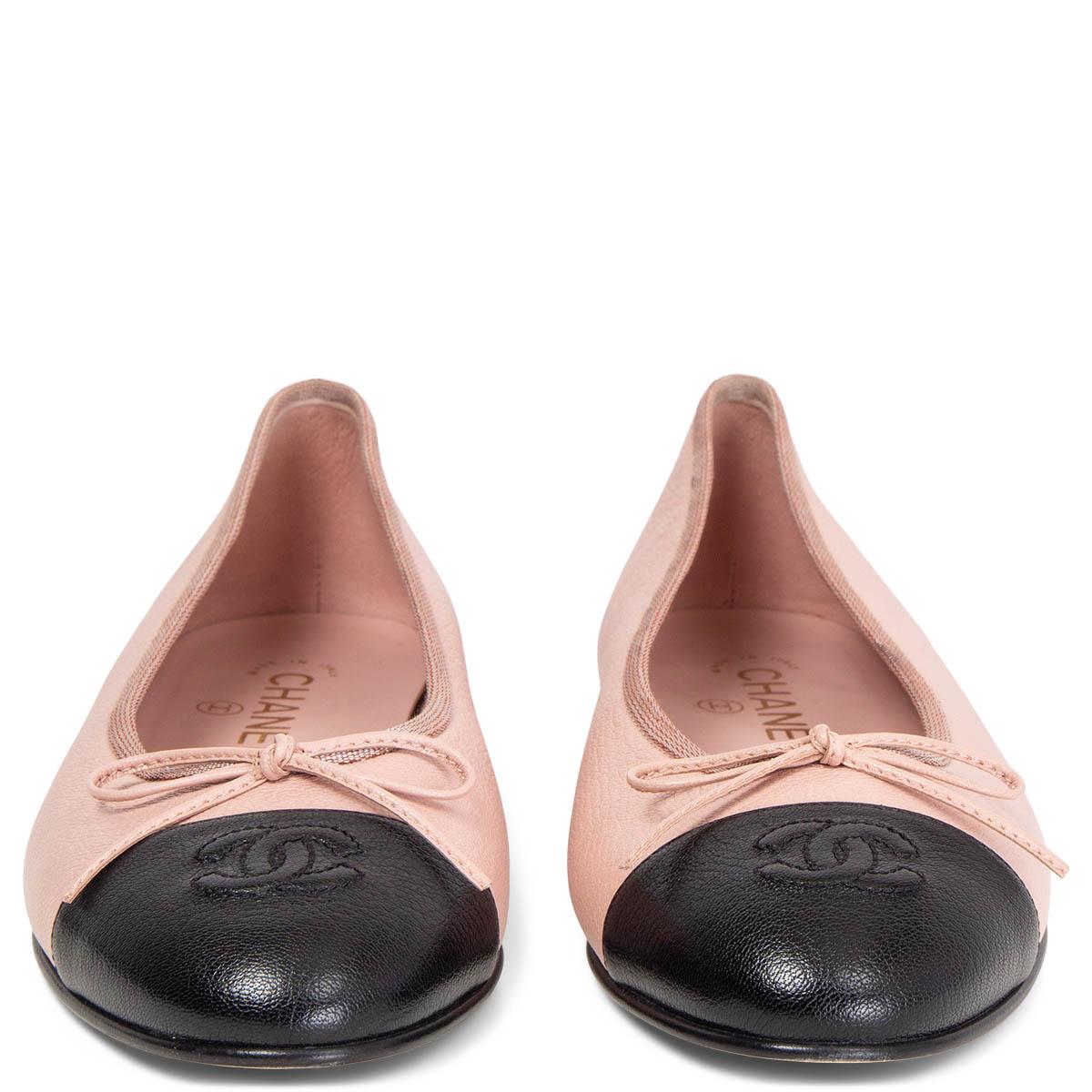 100% authentic Chanel classic ballet flats in pale pink grained calfskin with a black CC cap. Have been worn once and are in excellent condition. Come with dust bags. 

Measurements
Imprinted Size	38.5
Shoe Size	38.5
Inside Sole	24.5cm