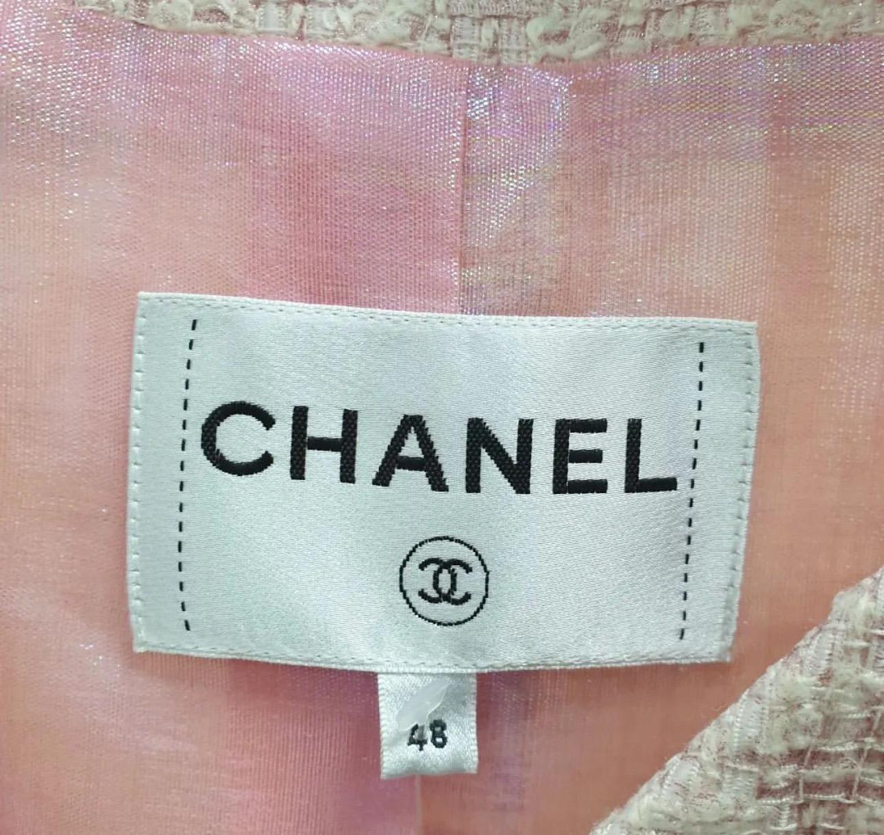 Stunning Chanel lightweight coat from the Spring 2016 collection. 
Made from candy pink and white basket weave polyester and silk mix with a fabulous iridescent polyester and cotton sheer metallic lining. 
It has slightly flared fit with slit front
