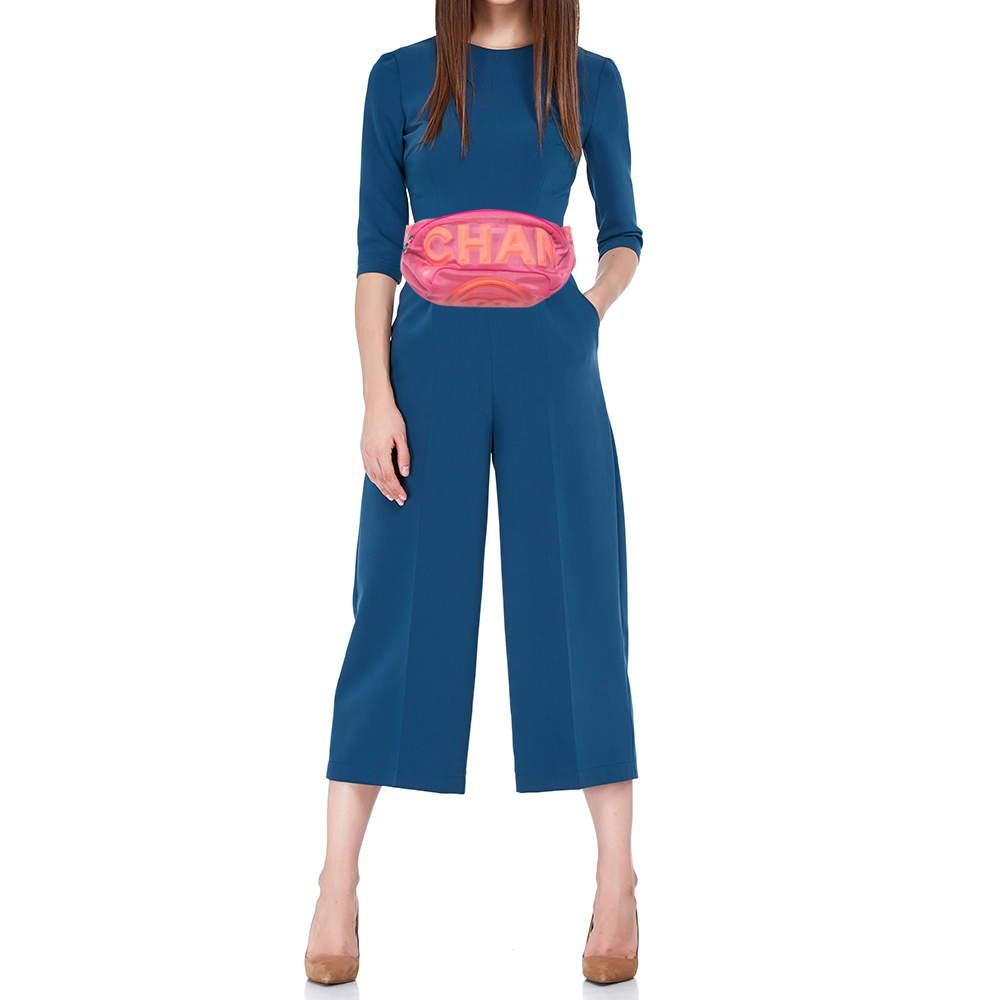 This uber-stylish Chanel waist belt bag aims to be an elevating piece. It is carefully created using mesh & fabric and has the brand name on the front. See how it transforms a T-shirt dress or a solid jumpsuit!

