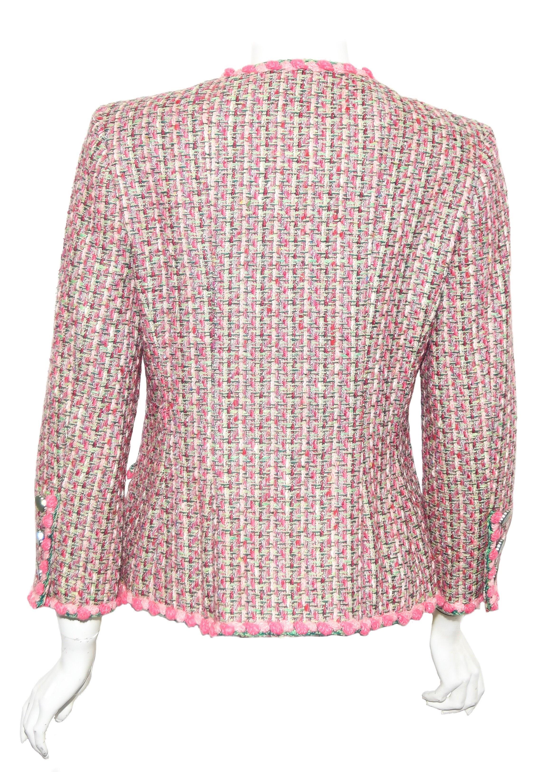 Chanel Multi color tweed spring 2002 jacket features the accent on pink tones and pink crocheted trim.  The pink trim incorporates 2 tones of pink crocheted rosettes throughout the jacket, on the cuffs, four pockets, around the neckline, down the