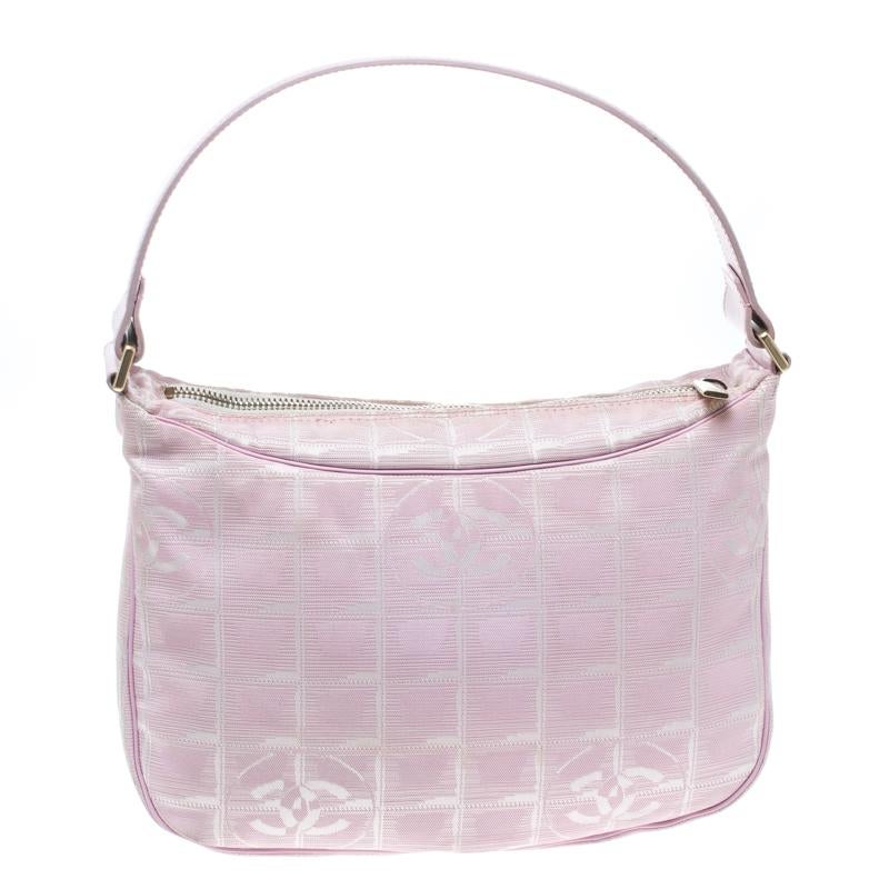 This Chanel Travel Line hobo is perfect for almost all the occasions that you want a beautiful companion for. Crafted from nylon the bag comes with a single handle and a pink exterior. The top zip closure opens to a fabric lined interior and will