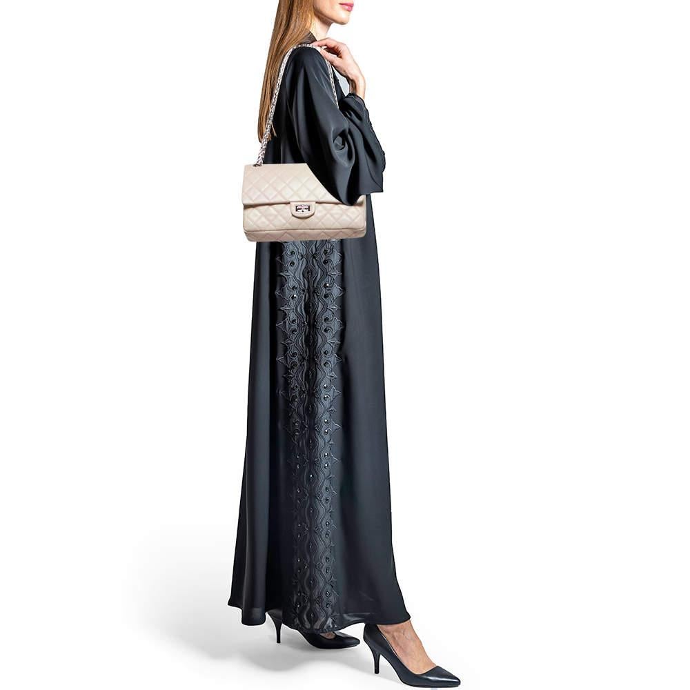 Imbued with traditional details  the Reissue 2.55 bag from Chanel is iconic and one of the most admired collections of the brand. The chain shoulder strap of this bag will offer you an easy carrying experience. Made from quilted leather  it flaunts