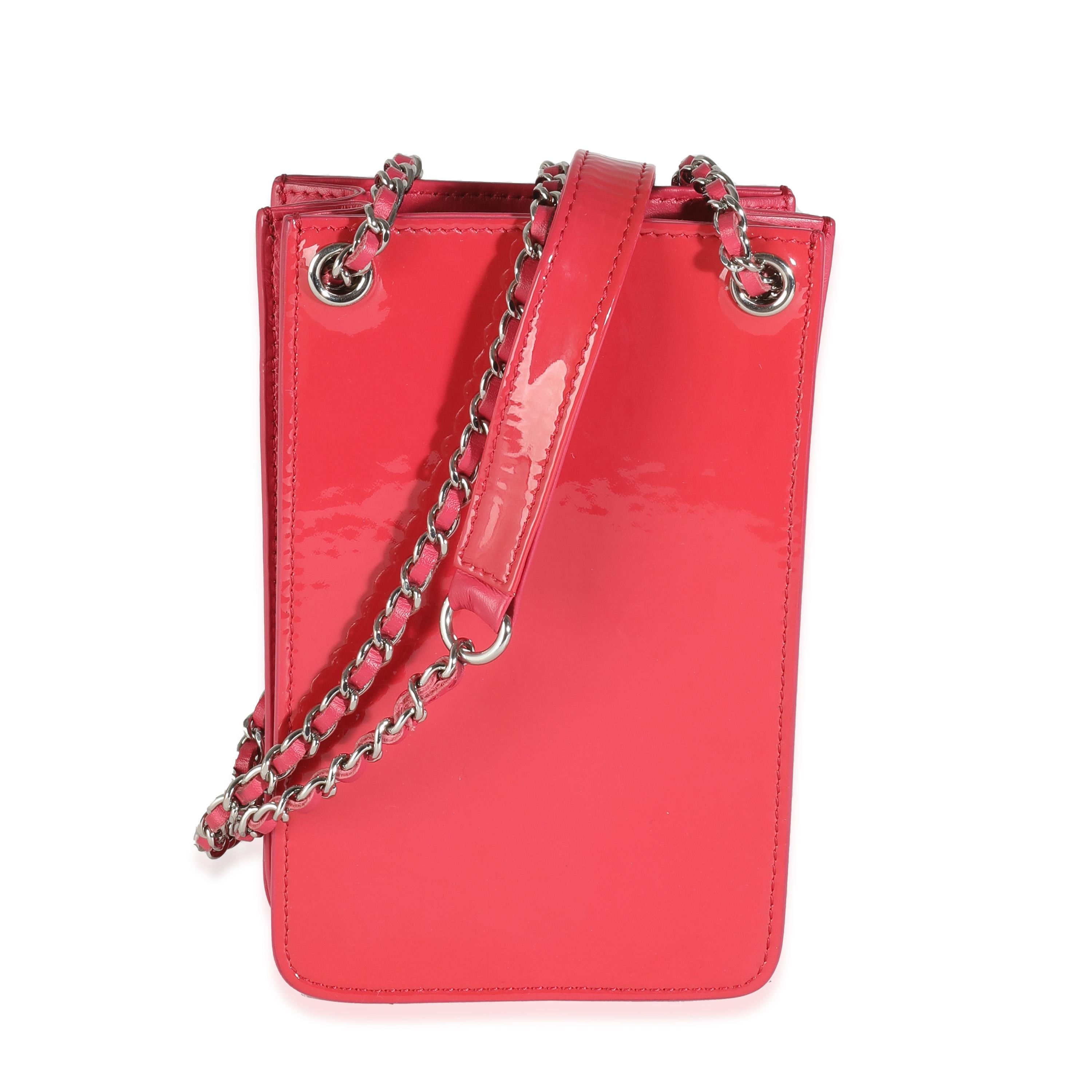 Listing Title: Chanel Pink Patent CC Phone Holder With Chain
SKU: 144400
Condition: Pre-owned 
Handbag Condition: Very Good
Condition Comments: Item is in very good condition with minor signs of wear.  Light scuffing along exterior. Discoloration