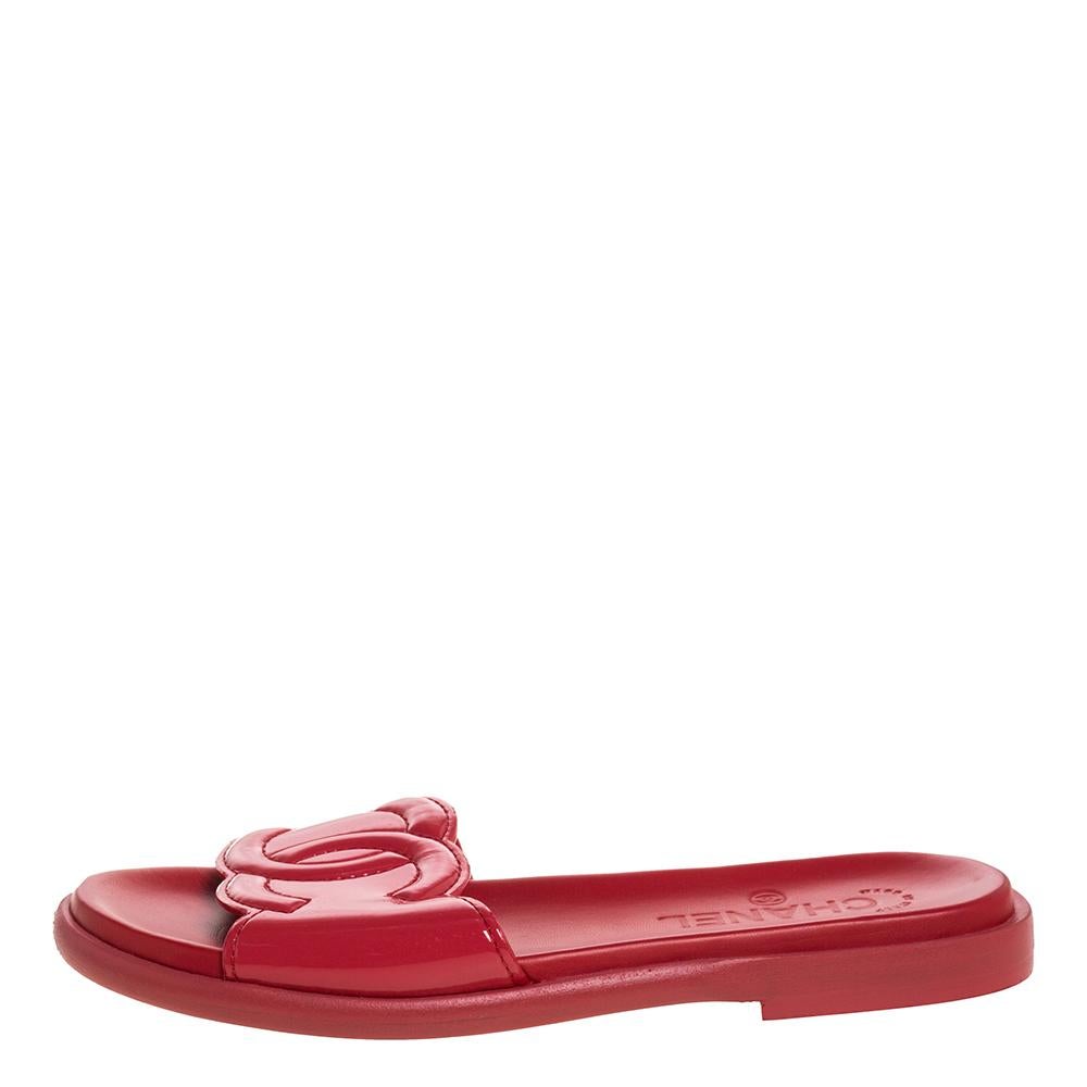 These slides from Chanel are trendy and easy to slip on. They have been crafted from glossy patent leather and designed with their signature CC logo perched on the uppers. They come in a shade of pink to essay high fashion in a sweet way.

