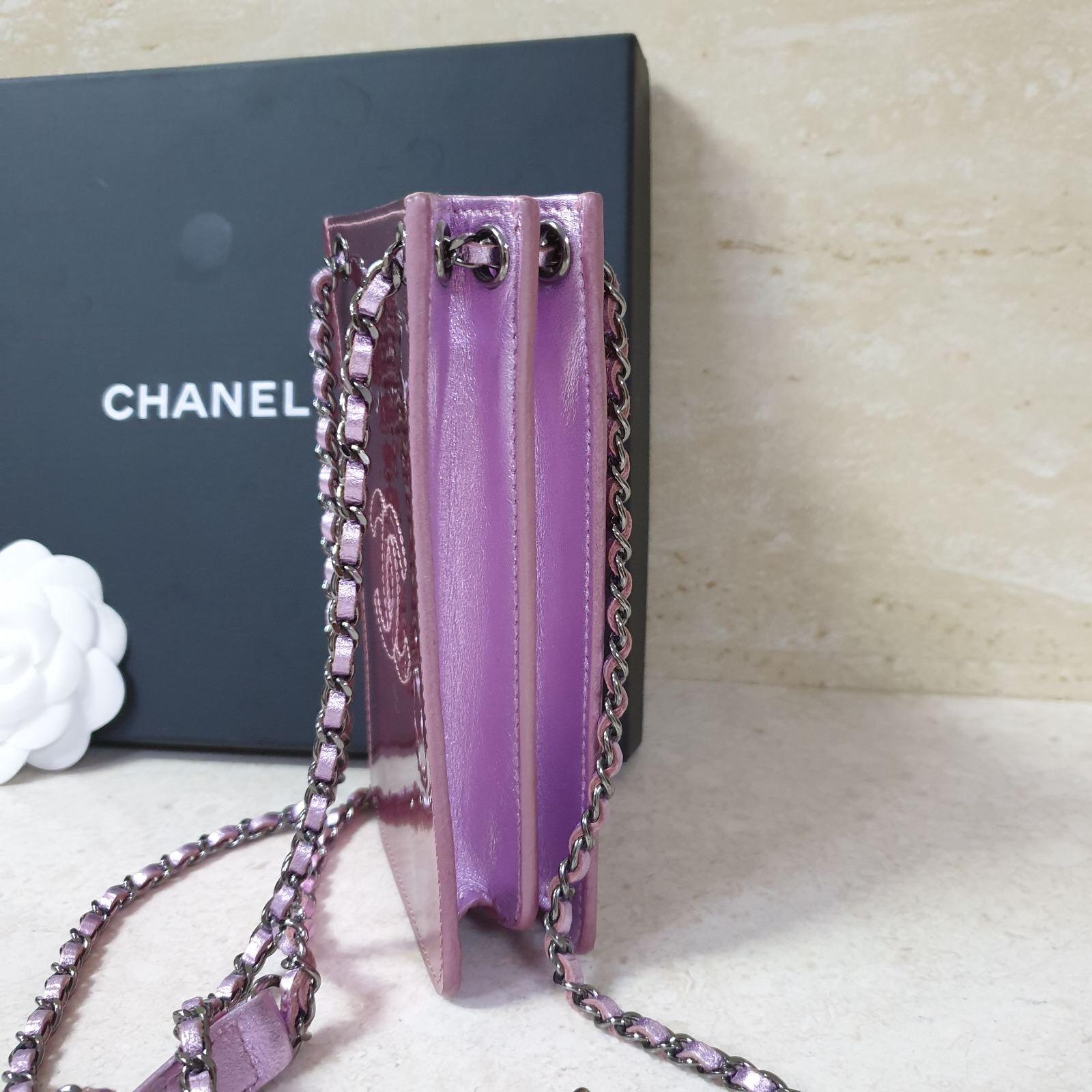 This is a cute accessory piece from Chanel and is very popular among Chanel lovers everywhere. The patent leather features an embroidered CC logo and adorable mini chain and leather entwined long strap. This pouch is perfect for your cell phone or