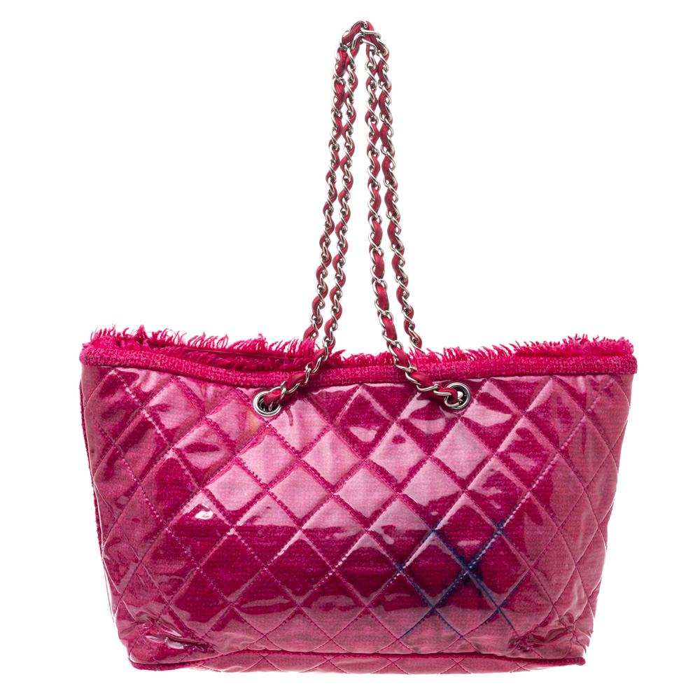 This Funny tote from Chanel looks pretty in pink! It comes crafted from PVC and tweed and features the signature quilted pattern on the exterior. It has been styled with the iconic CC logo on the front and dual chain and leather woven handles. The