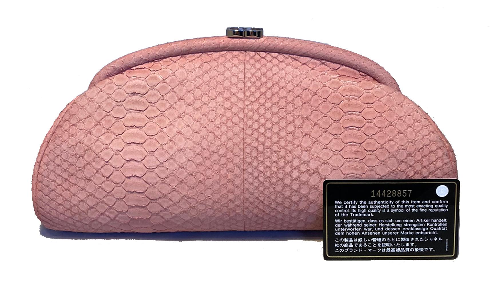 Chanel Pink Python Timeless Clutch in excellent condition. Pink peach matte python snakeskin exterior trimmed with gunmetal CC logo lift top closure. Pale pink soft lambskin leather interior with one side zippered pocket. Clean corners and exterior