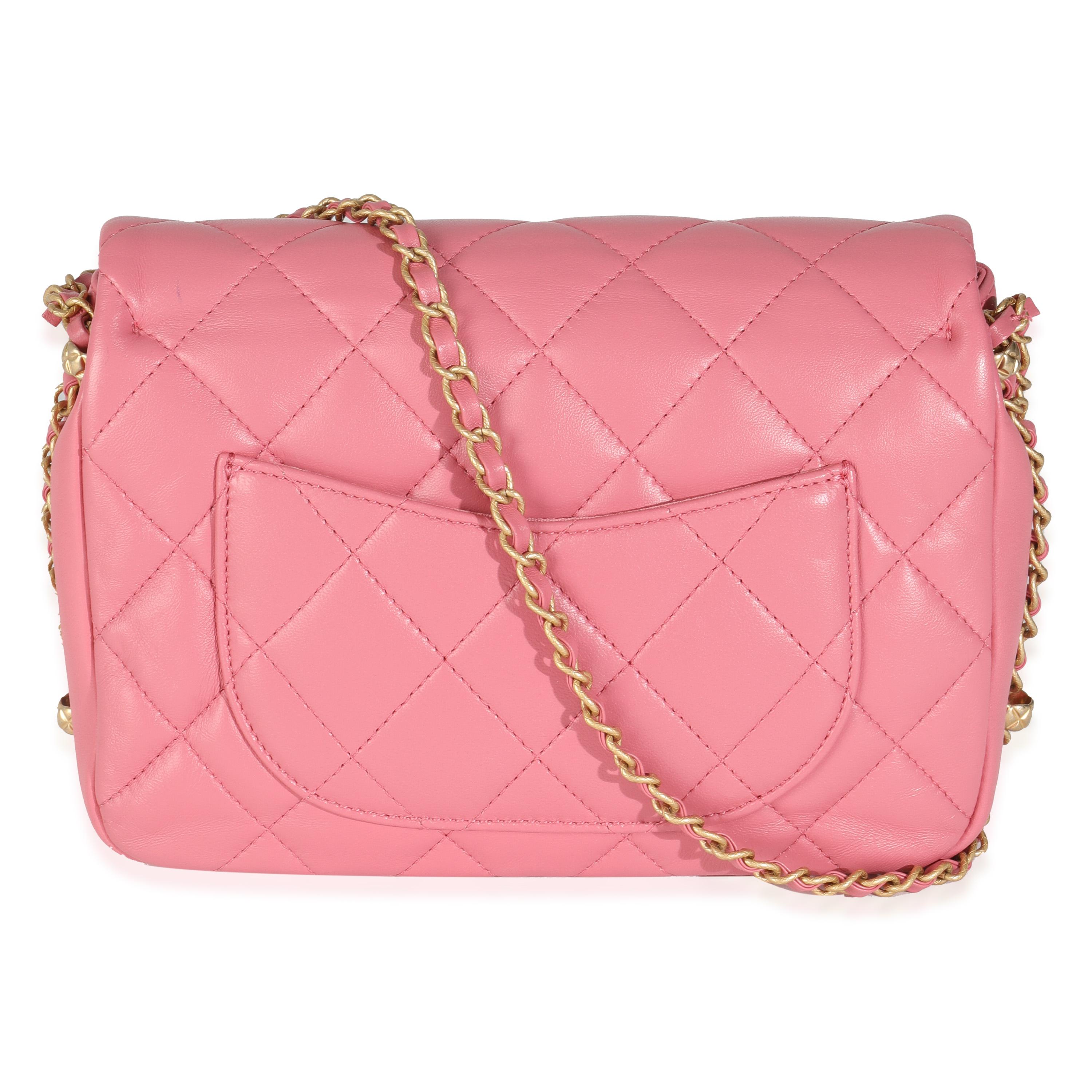 Listing Title: Chanel Pink Quilted Calfskin Chain Around Mini Square Flap Bag
SKU: 145246
Condition: Pre-owned 
Condition Description: A timeless classic that never goes out of style, the flap bag from Chanel dates back to 1955 and has seen a number