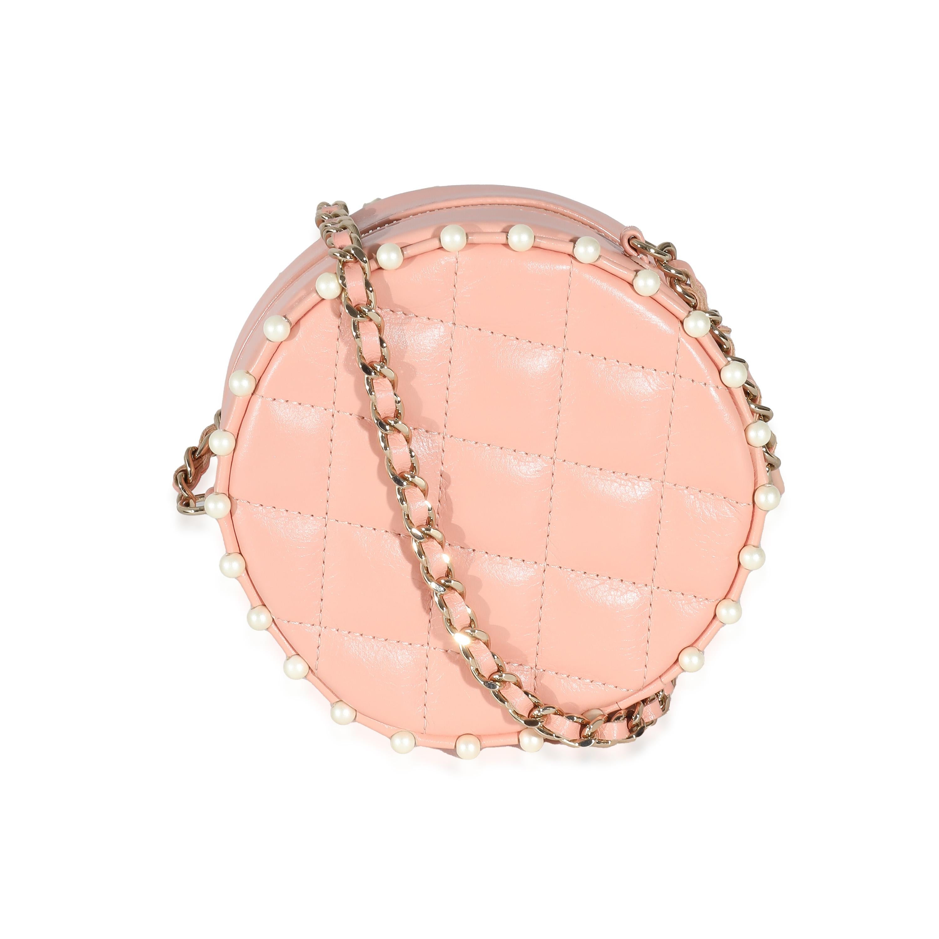 Listing Title: Chanel Pink Quilted Calfskin Pearl Round Clutch With Chain
SKU: 137515
Condition: Pre-owned 
Handbag Condition: Excellent
Condition Comments: Item is in excellent condition and displays light signs of wear. Faint scuffing along