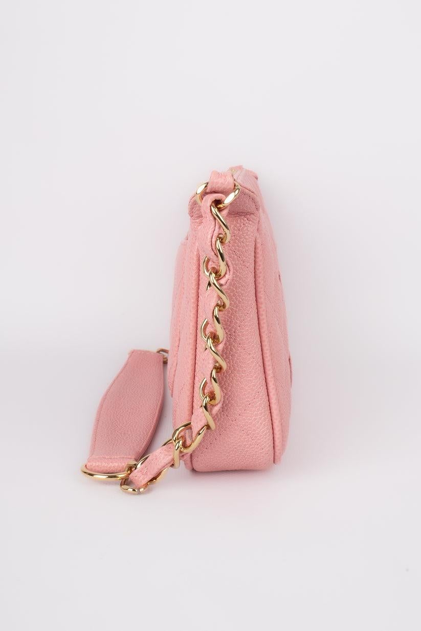 Chanel- (Made in Italy) Pink quilted Caviar grain calf leather shoulder bag topped with the House acronym, and a shoulder handle decorated with and interlaced golden metal chain. Sold with a serial number, an authenticity certificate, and a