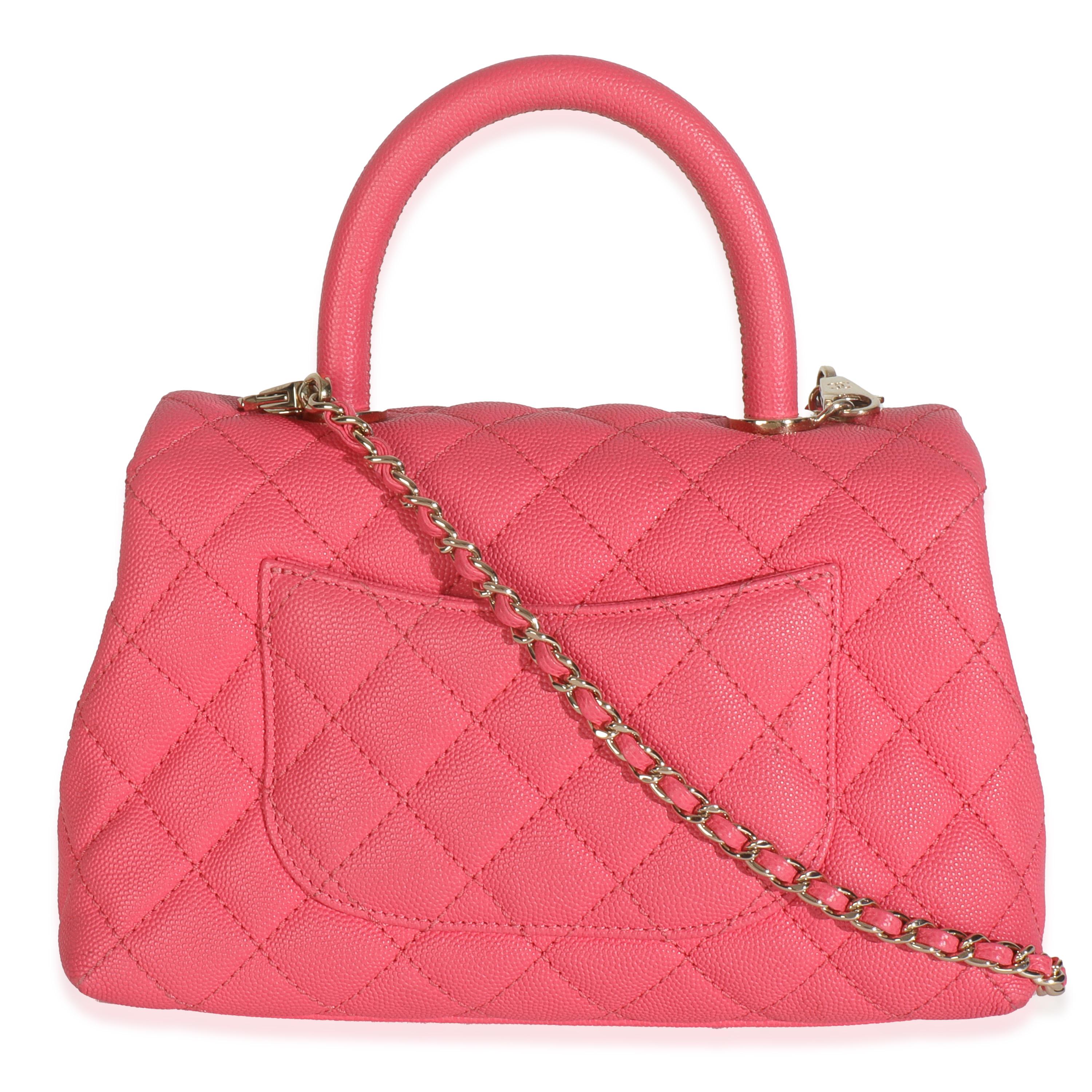 Listing Title: Chanel Pink Quilted Caviar Mini Coco Top Handle Flap Bag
SKU: 148702
Condition: Pre-owned 
Condition Description: A timeless classic that never goes out of style, the flap bag from Chanel dates back to 1955 and has seen a number of