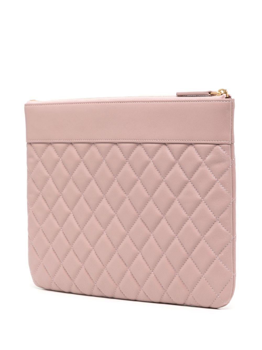* Light pink
* Leather
* Signature interlocking CC turn-lock pendant
* Diamond quilting
* Top zip fastening
* One main compartment
* Excellent Condition: This previously owned item is in near-perfect condition.

Please note that most items we carry