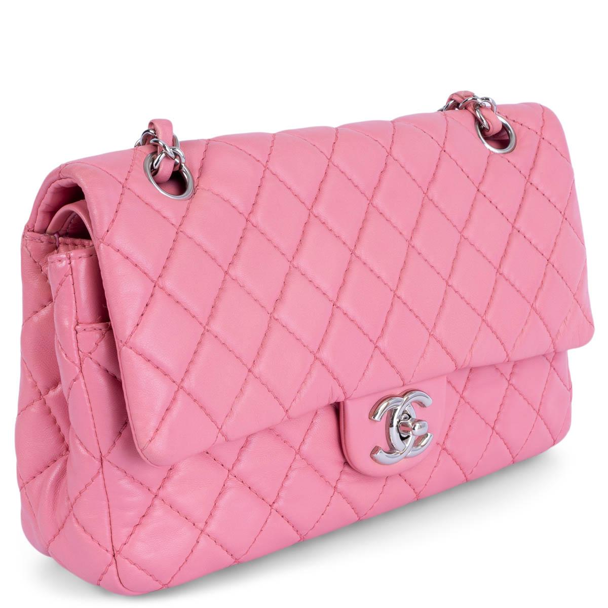 100% authentic Chanel Soft Classic Medium Timeless Double Flap Bag in pink lambskin featuring silver-tone hardware. Open pocket on the back. Closes with classic CC-turn-lock on the front. Zipper pocket inside the flap. Outside pocket on the front