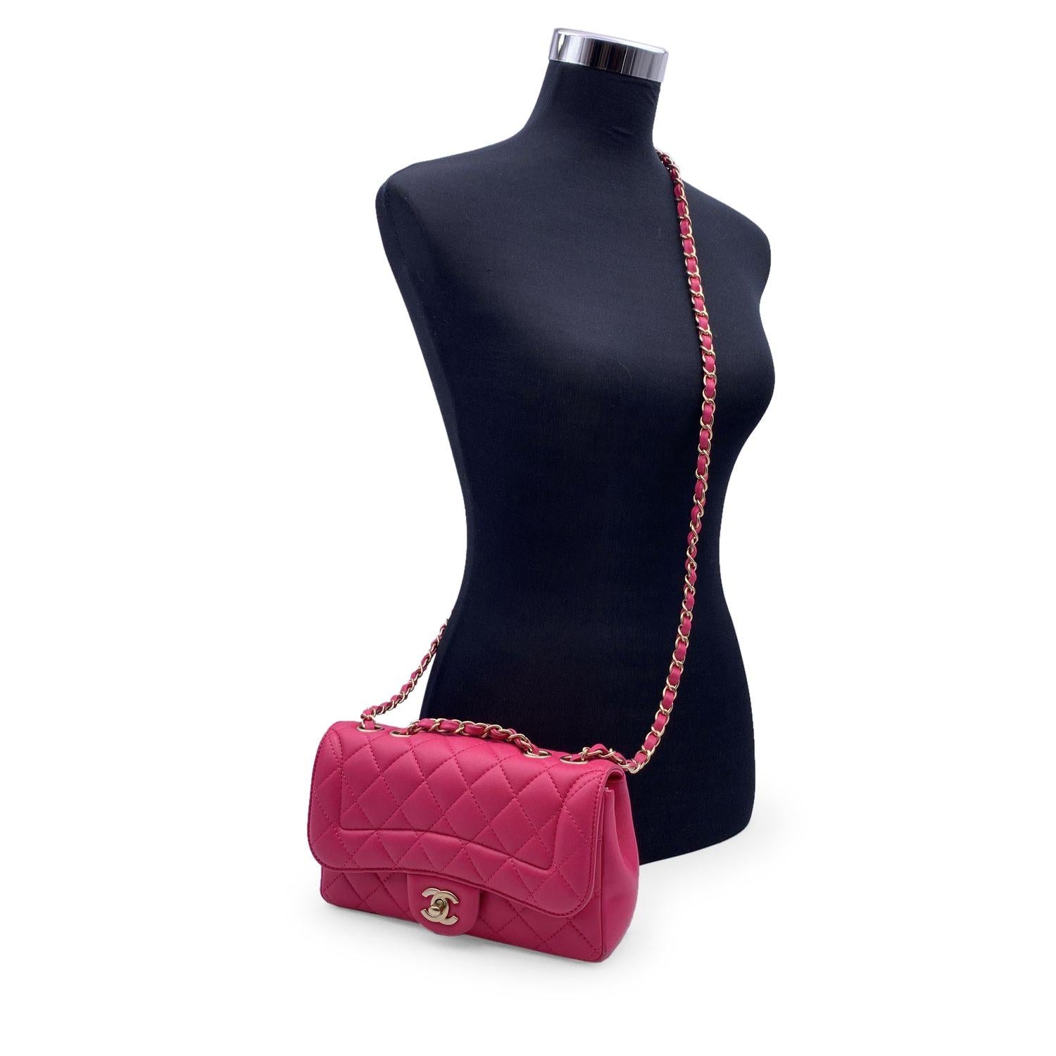 Lovely Chanel 'Mini Mademoiselle Chic' Flap shoulder bag. Pink fuchsia quilted lambskin leather. Light matte gold metal hardware. Period/Era: 2016. It features double 'CC' turn lock closure. Interwoven chain/leather strap; can be worn on the