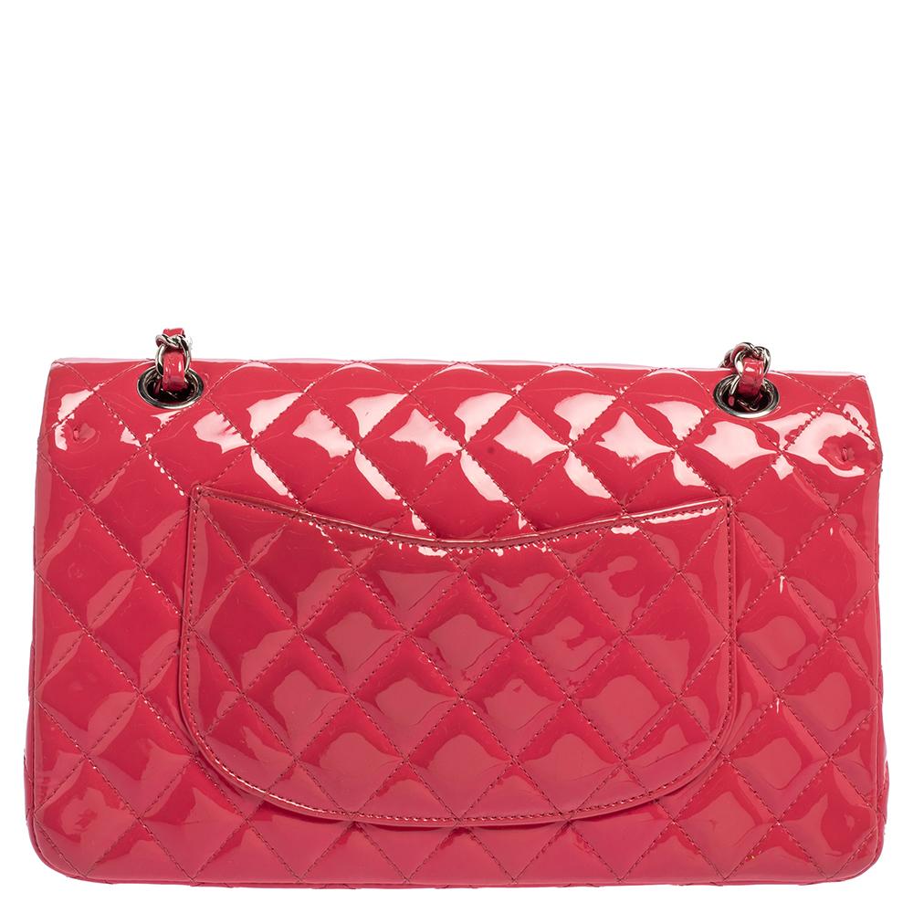 We are in utter awe of this flap bag from Chanel as it is appealing in a surreal way. Exquisitely crafted from patent leather in their quilt design, it bears their signature label on the leather interior and the iconic CC turn-lock on the flap. The