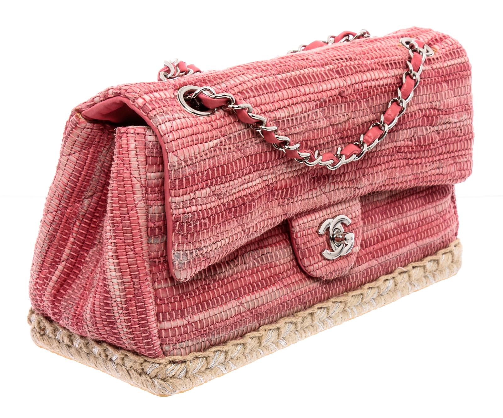 From the Chanel Cruise 2011 collection, this Quilted Pink Tweed Espadrille Chain Flap bag features gorgeous multi-colored woven pink fabric in the classic diamond quilted pattern, braided rope details at the bottom and a fashionable yet durable