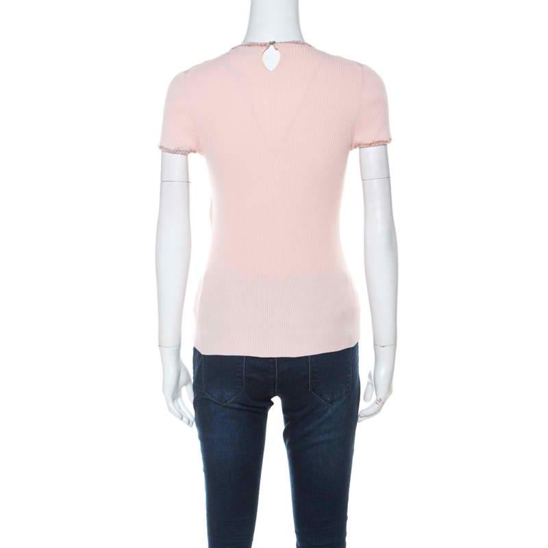 You must get your hands on this lovely creation from Chanel. The top is made from quality fabric and it has short sleeves and all over, there are ribbed patterns. It is perfect for long casual sprees.

Includes: The Luxury Closet Packaging

