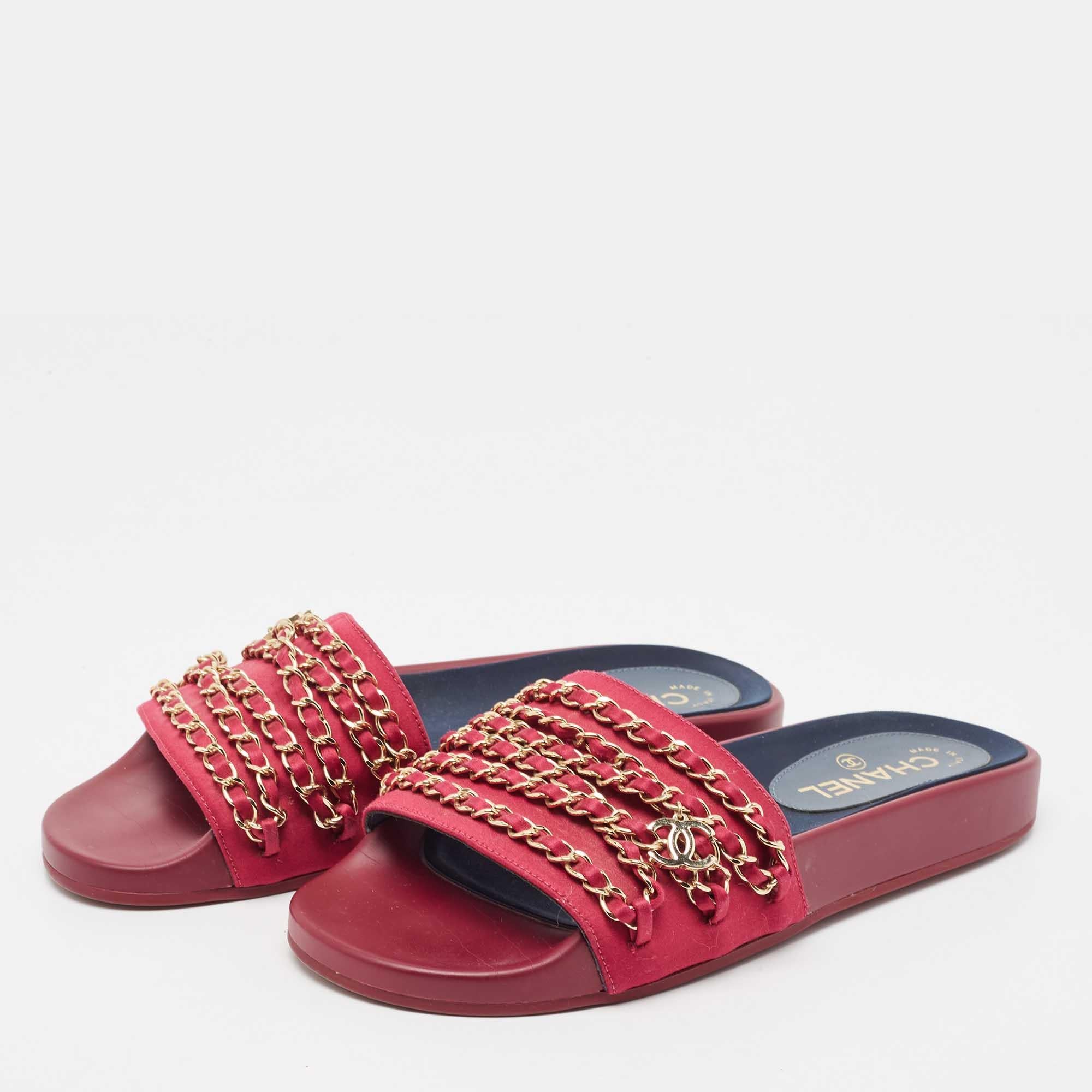These embellished slides from Chanel have been designed to lift your style. They are crafted from satin and are designed to secure your feet fashionably.

