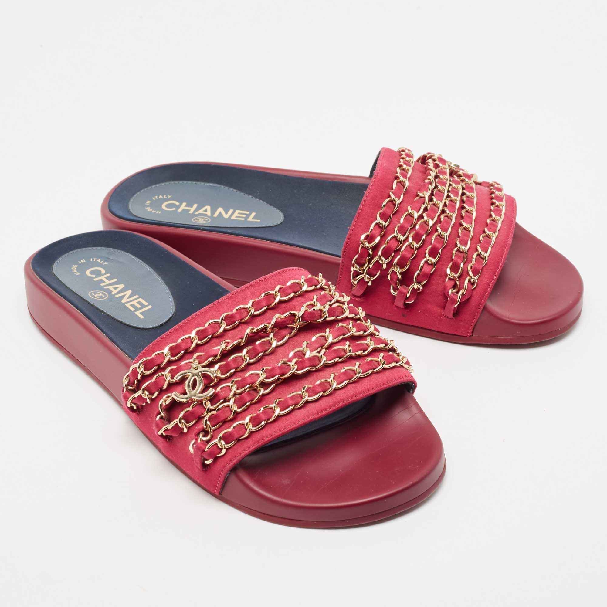 These embellished slides from Chanel have been designed to lift your style. They are crafted from satin and are designed to secure your feet fashionably.

